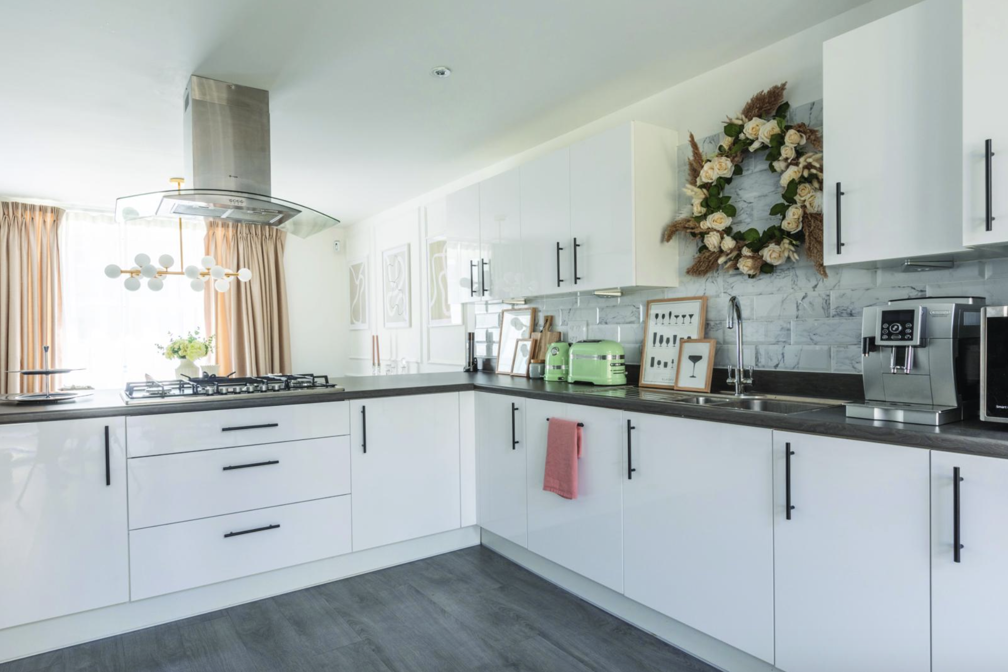 Yooni has kept the kitchen fresh with marble tiles from Victorian Plumbing, artworks from Swedish print shop Kunskapstavlan, and a homemade wreath to add natural texture Yooni has kept the kitchen fresh with marble tiles from Victorian Plumbing, artworks from Swedish print shop Kunskapstavlan, and a homemade wreath to add natural texture