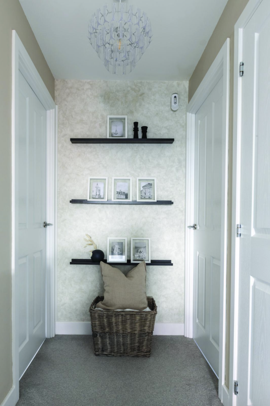 Yooni has made clever use of this wall on the landing with black slimline shelves from B&M, home to her cherished photos that she can add to and change over time Yooni has made clever use of this wall on the landing with black slimline shelves from B&M, home to her cherished photos that she can add to and change over time