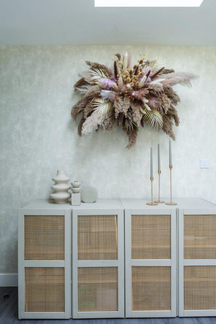 Yooni’s pretty handmade flower cloud is suspended from the ceiling using stick-on hooks. She’s kept the styling on her sideboard – a hacked IKEA Ivar cabinet – minimal and chosen Designers Guild Parchment wallpaper in Silver to showcase it Yooni’s pretty handmade flower cloud is suspended from the ceiling using stick-on hooks. She’s kept the styling on her sideboard – a hacked IKEA Ivar cabinet – minimal and chosen Designers Guild Parchment wallpaper in Silver to showcase it
