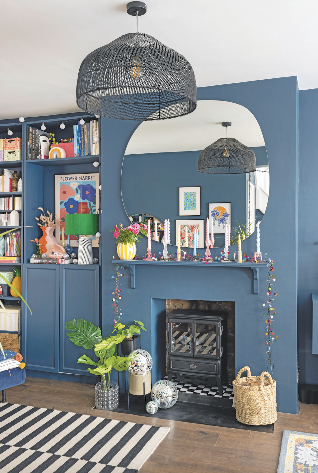‘I wanted a neat, streamlined fire surround, so I bought a cheap bookshelf, attached it with budget wooden brackets, and then painted it the same colour as the wall for a modern look’ ‘I wanted a neat, streamlined fire surround, so I bought a cheap bookshelf, attached it with budget wooden brackets, and then painted it the same colour as the wall for a modern look’