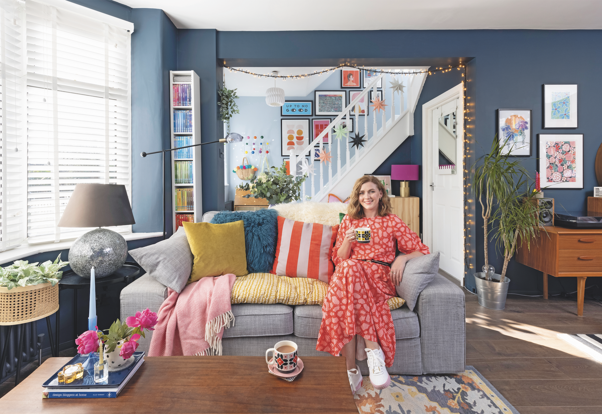 Charlie has grounded her colourful room with navy blue walls, and grey and vintage wooden furniture, so the space feels well thought out. Painting the stairs white, and giving the back wall a splash of lighter blue, stops the room from feeling too dark Charlie has grounded her colourful room with navy blue walls, and grey and vintage wooden furniture, so the space feels well thought out. Painting the stairs white, and giving the back wall a splash of lighter blue, stops the room from feeling too dark