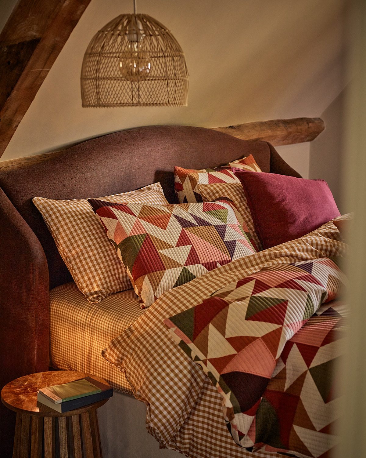 A bed featuring a quilt