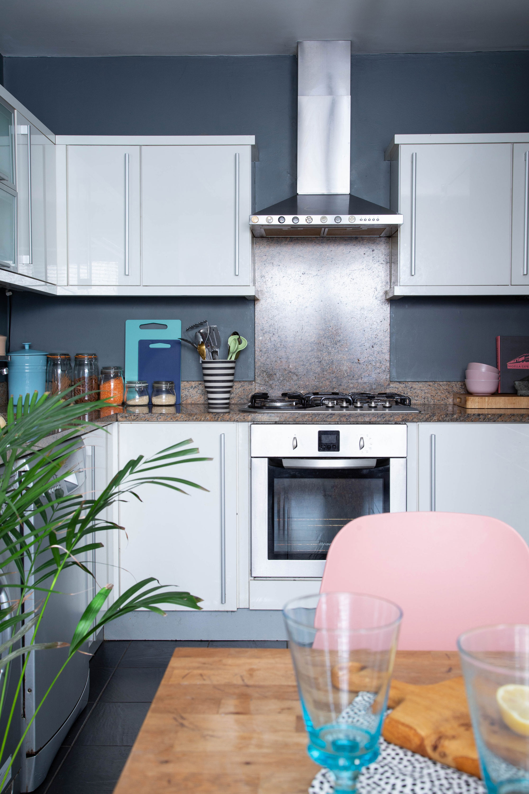 ‘The kitchen cupboards and countertops are the originals that came with the property,’ says Elaine. ‘I’ve layered as much colour and texture as I can to try and soften the starkness of the white.’