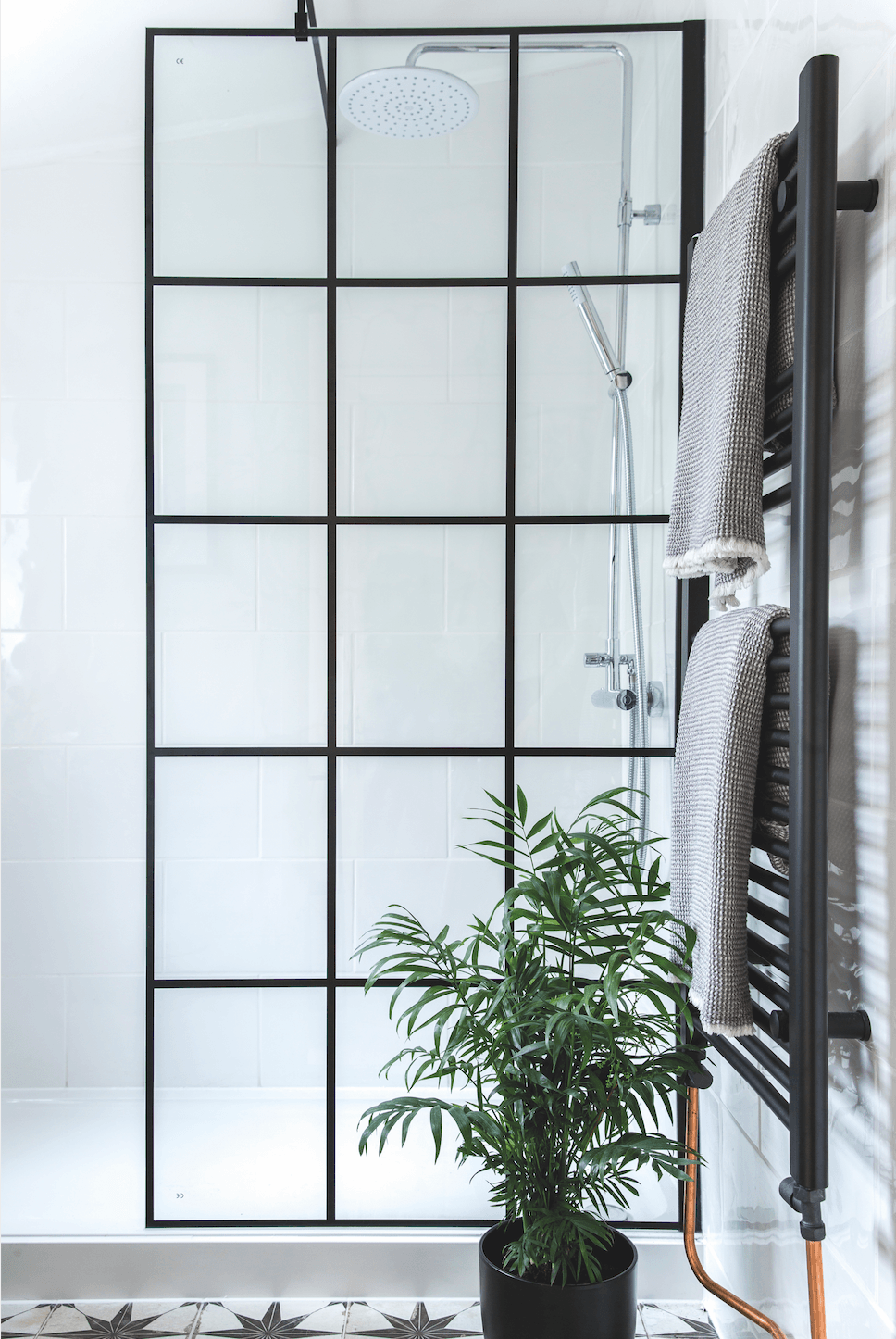The Crittall-window style shower screen is the focal point of the room and was one of the must-have items on Lorna and James’s wish list. They bought it in a sale for a fraction of the usual price Bathroom makeover: 'Our bathroom feels like a mini boutique hotel'
