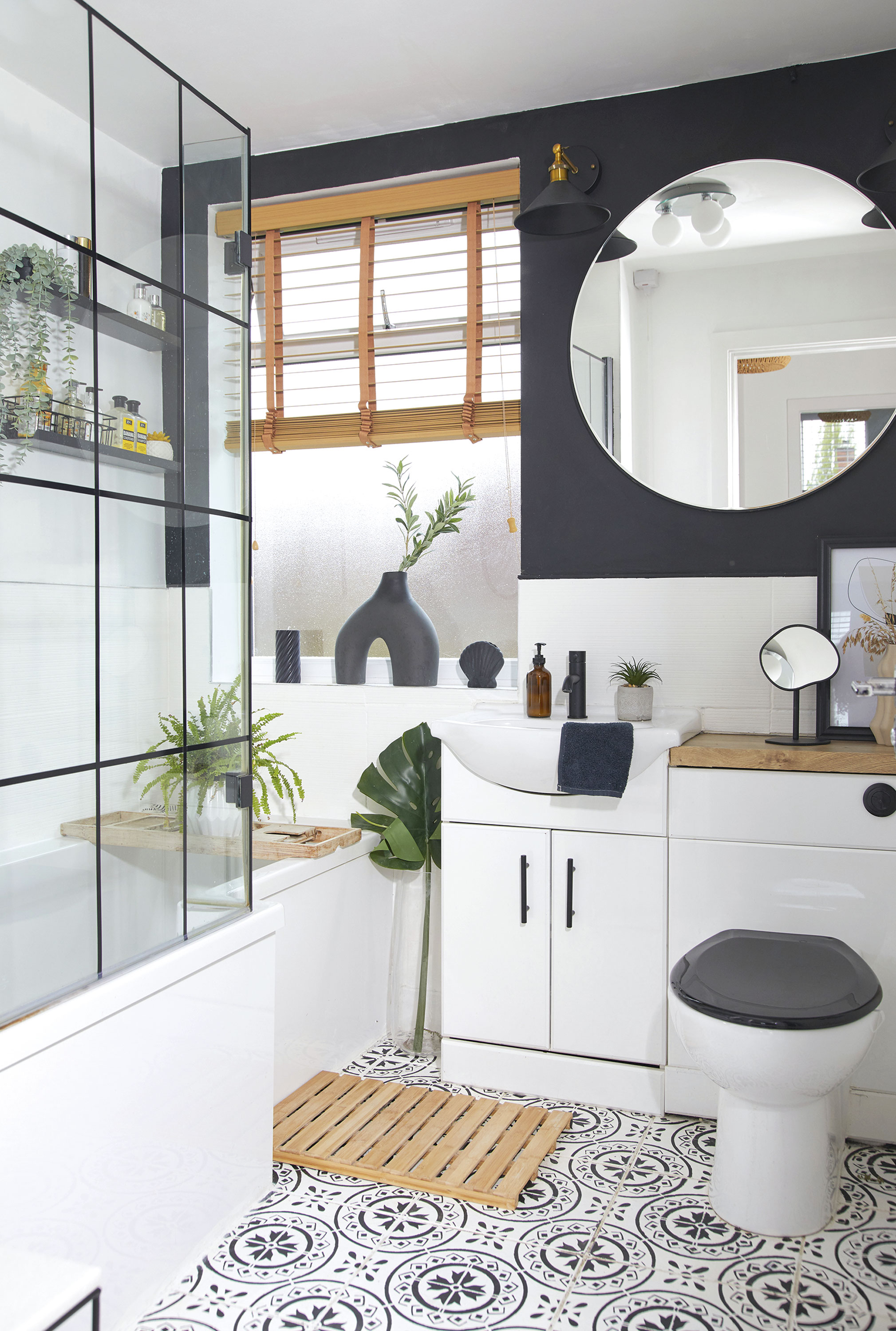 'DIY hacks have saved us a fortune' ‘I painted the shower screen black and then used electrical tape to make it look like a Crittall-style screen. I added the black loo seat to finish the look’