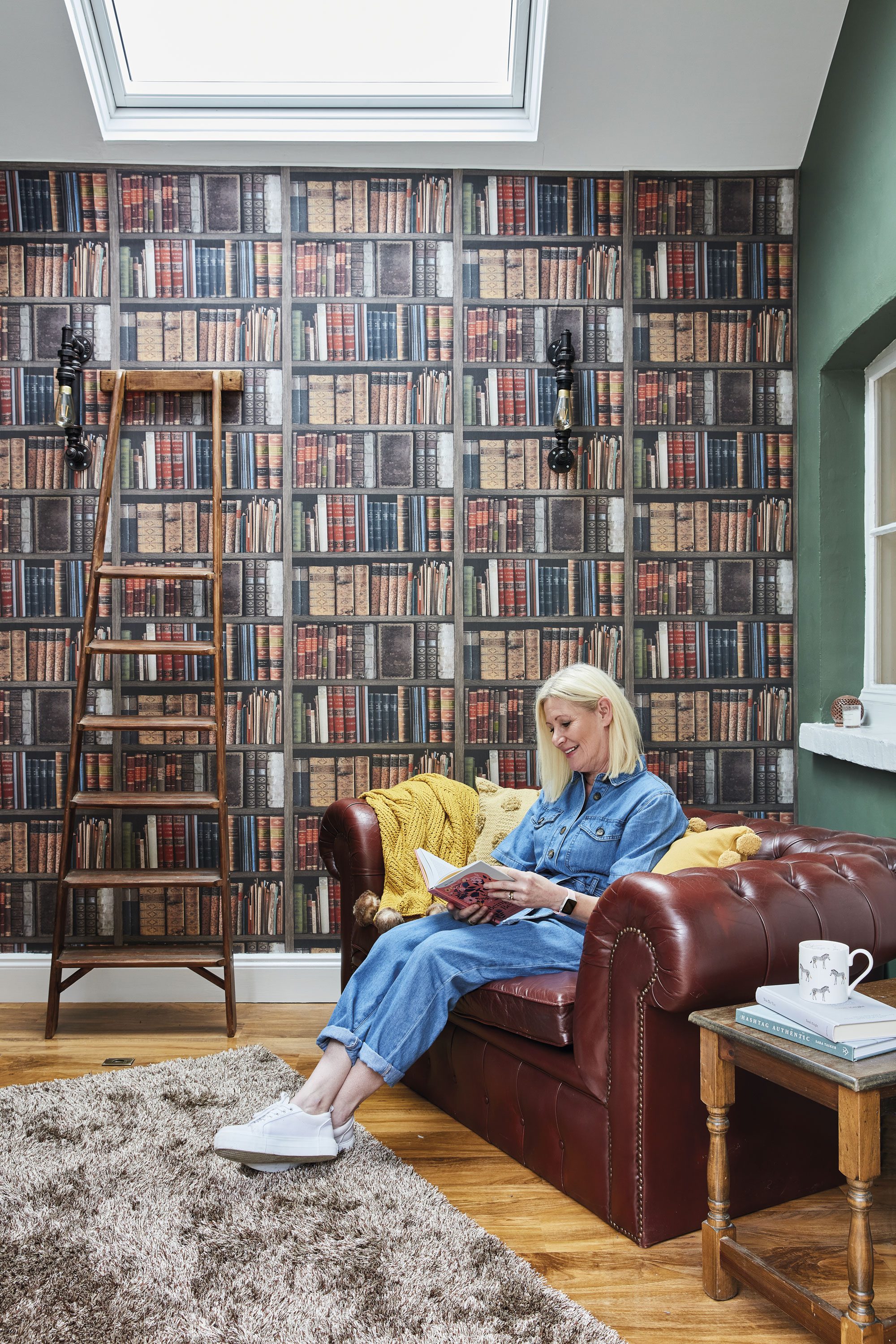 Good idea! Fake a home library with book wallpaper. You could even prop up a ladder to complete the look! Good idea! Fake a home library with book wallpaper. You could even prop up a ladder to complete the look!