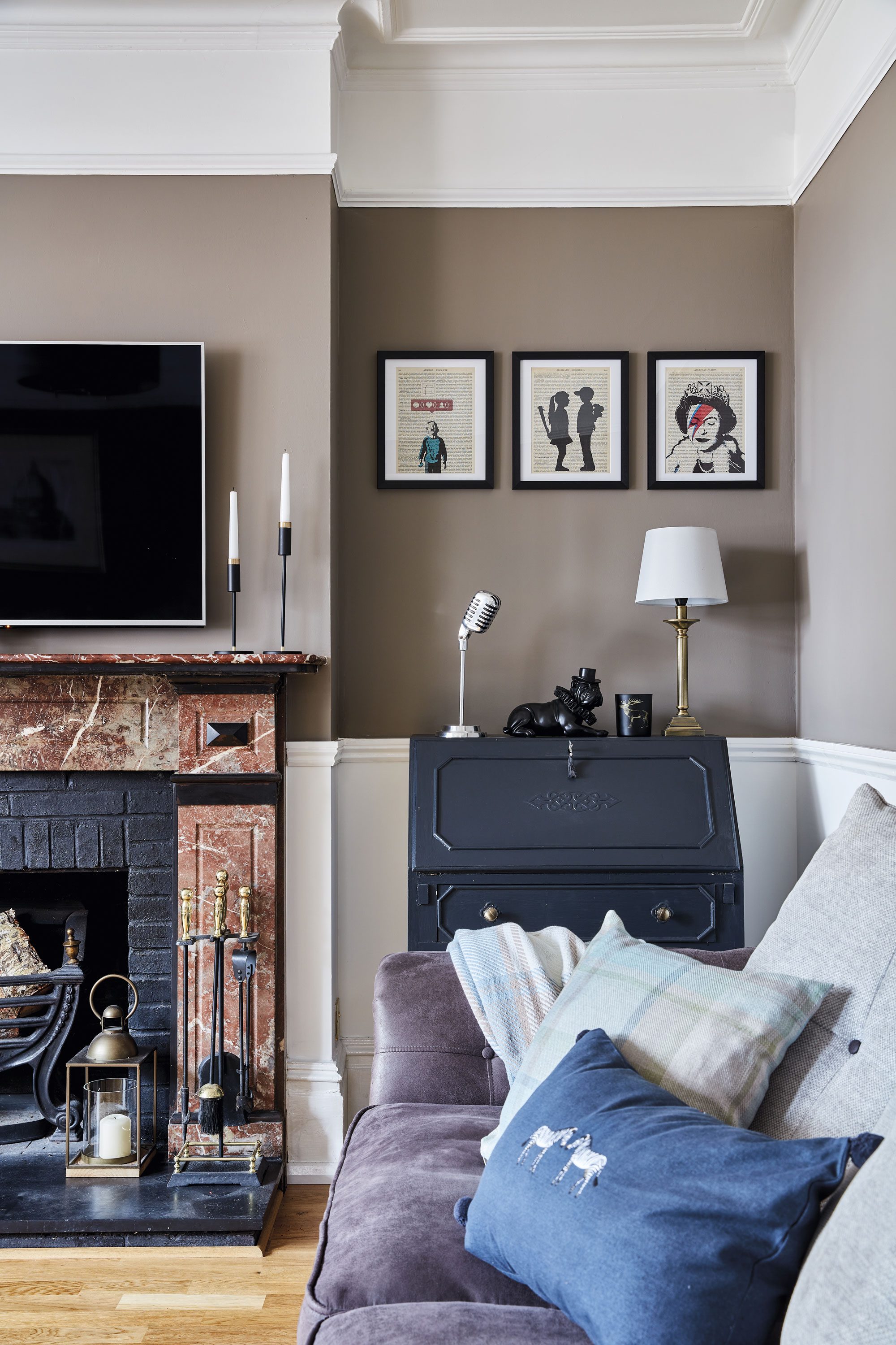 Taking pride of place in the living room is the unusual marble fire surround. ‘The fire basket was from our old home,’ explains Sharon. ‘It was in our garden for about eight years just sitting there waiting for the moment when we could use it again’ Taking pride of place in the living room is the unusual marble fire surround. ‘The fire basket was from our old home,’ explains Sharon. ‘It was in our garden for about eight years just sitting there waiting for the moment when we could use it again’