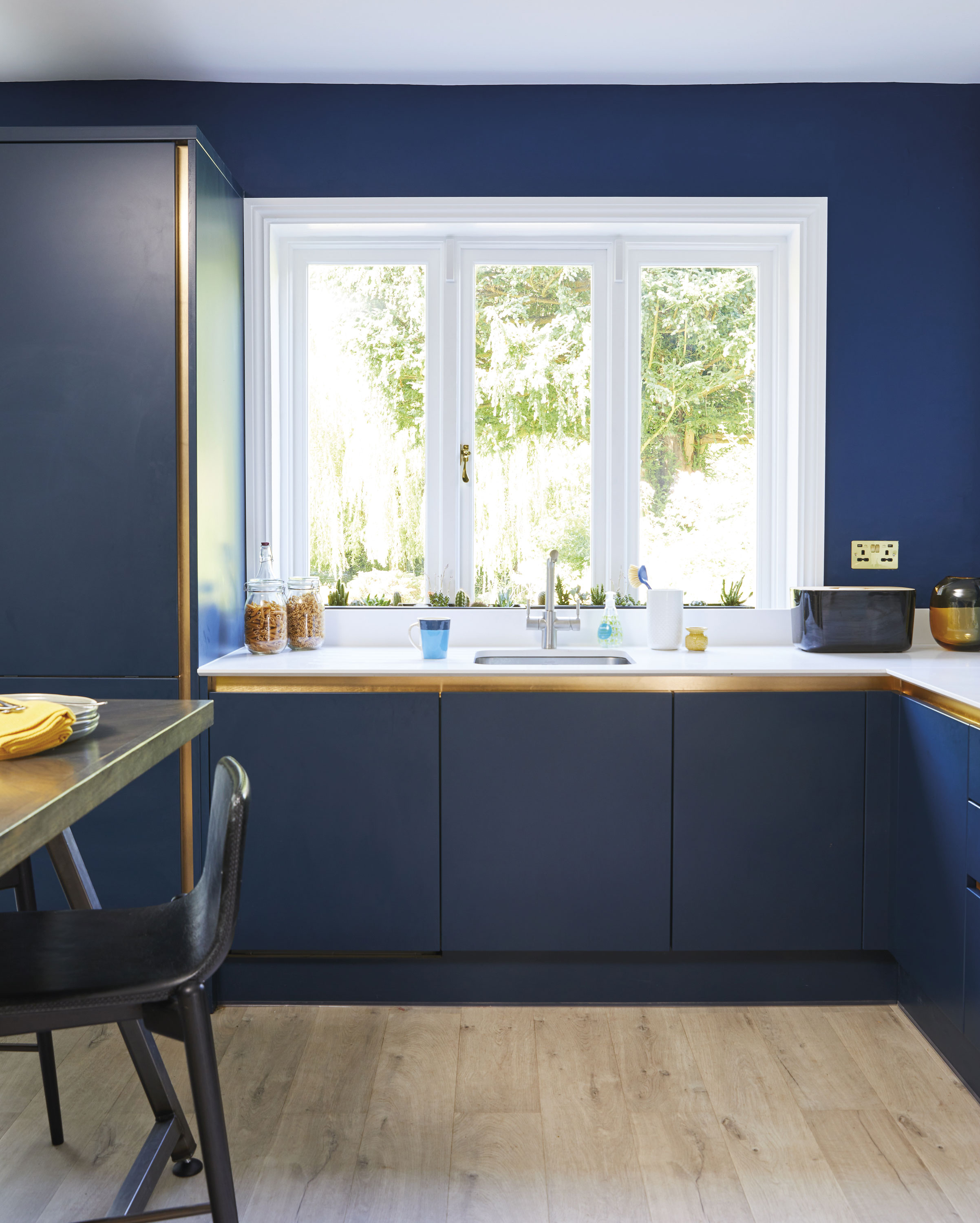 Previously positioned on the peninsula, a new sleek undermount sink, with boiling water tap, now sits in front of the main window, so when using it the couple can take advantage of the garden views Previously positioned on the peninsula, a new sleek undermount sink, with boiling water tap, now sits in front of the main window, so when using it the couple can take advantage of the garden views