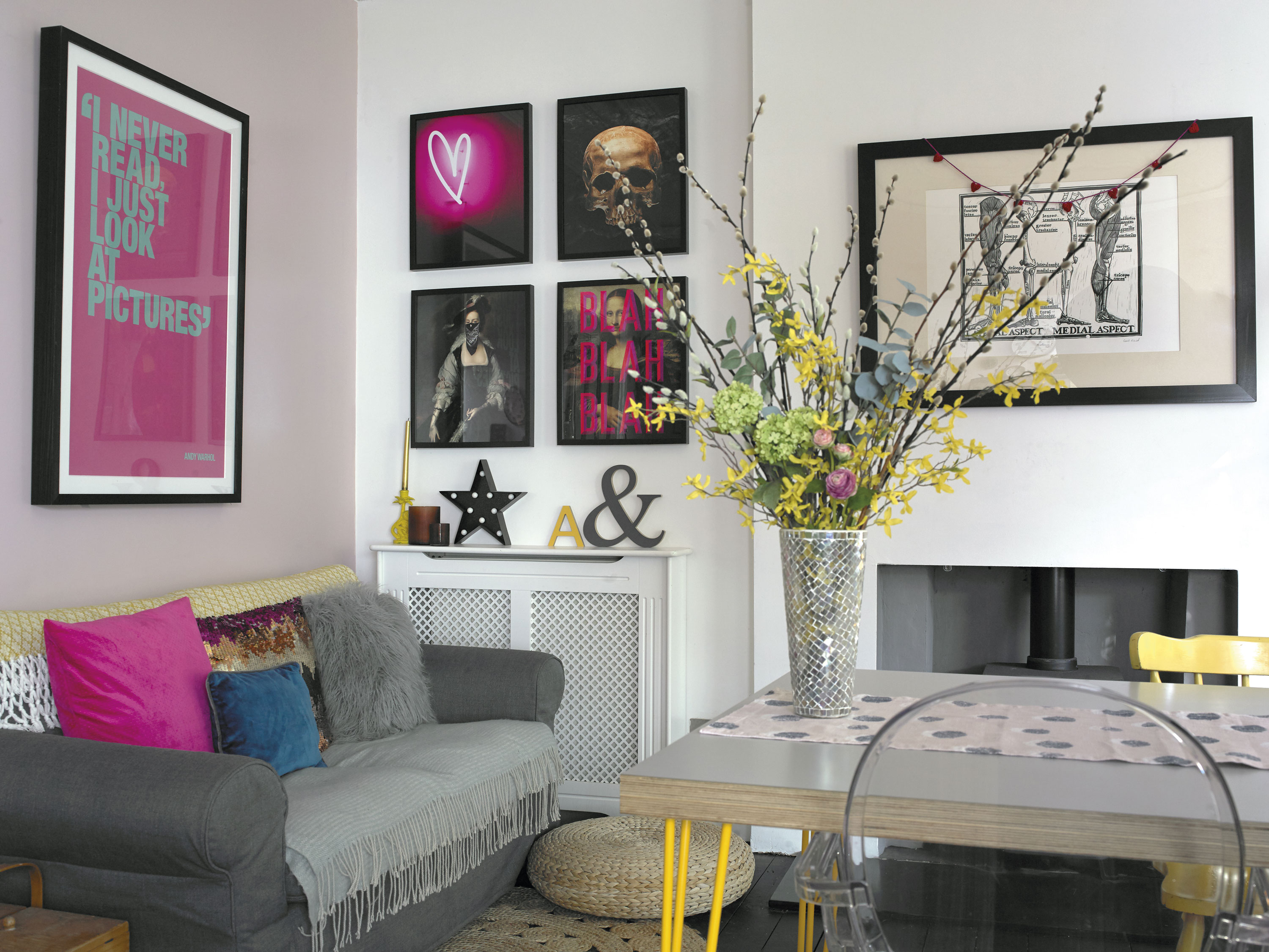 Lisa has used a lot of different shades of pink, but has complemented them with black and yellow, creating a bold, rather than feminine look. The transparent Louis Ghost chair, designed by Philippe Starck for Kartell, adds a designer touch to the eclectic room Lisa has used a lot of different shades of pink, but has complemented them with black and yellow, creating a bold, rather than feminine look. The transparent Louis Ghost chair, designed by Philippe Starck for Kartell, adds a designer touch to the eclectic room