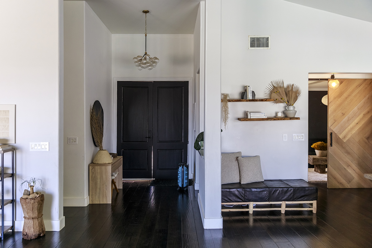 An elegant hallway with dark, wooden floors