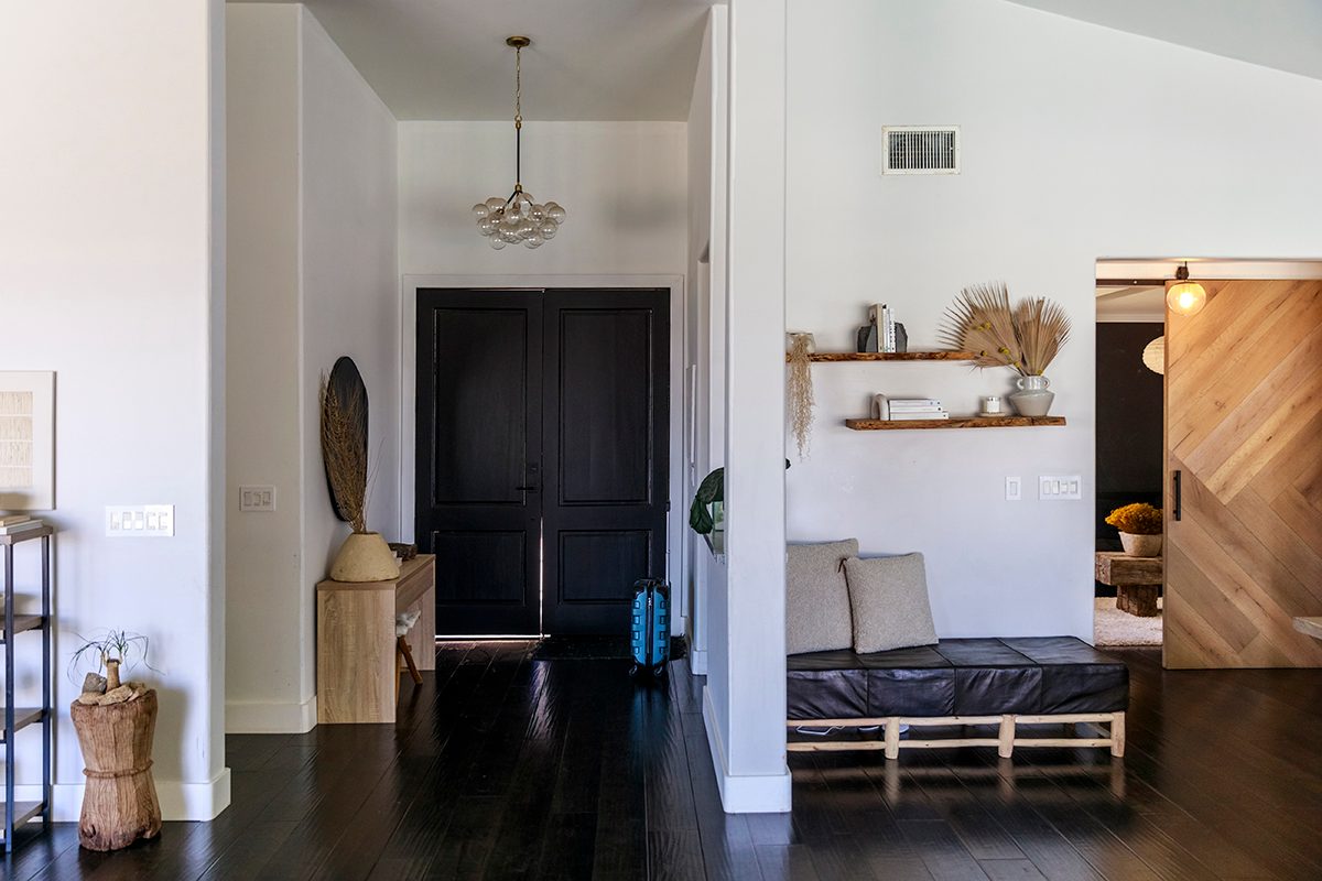 An elegant hallway with dark, wooden floors