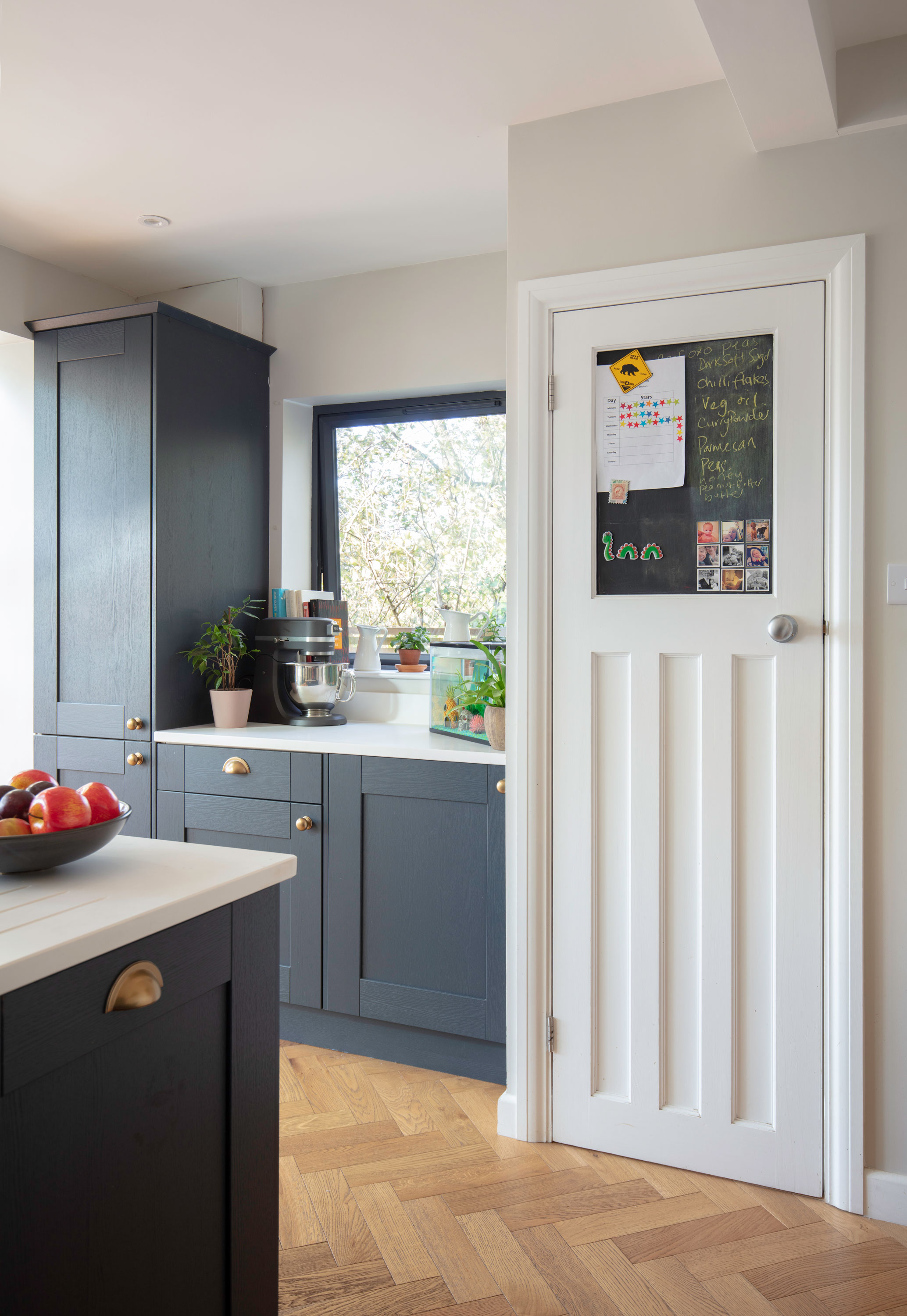 Good idea! Use blackboard paint to turn a plain door panel into a handy family planner and noticeboard