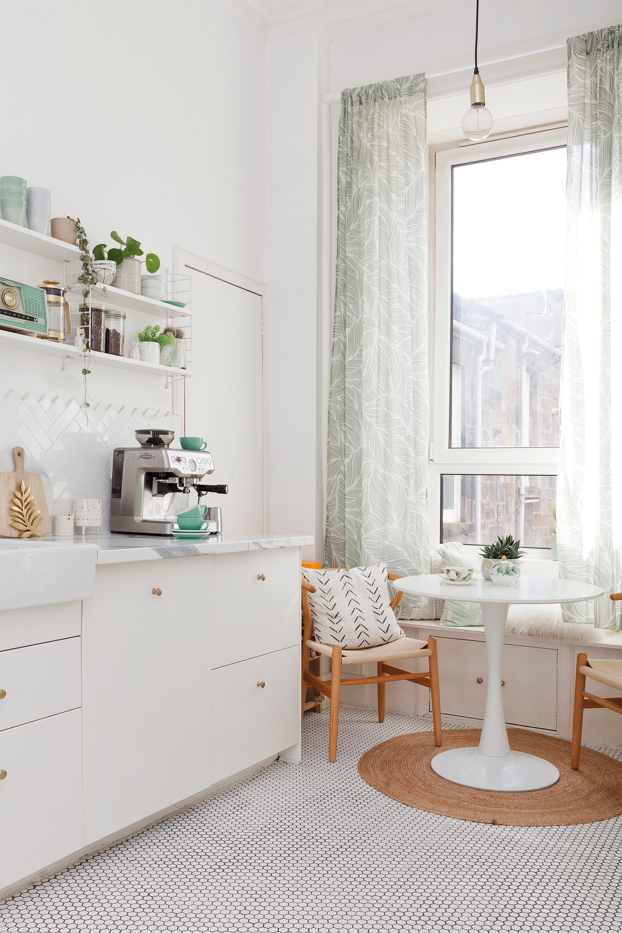 Home makeover: 'Our flat has bags of character!' Kate’s picture-perfect kitchen has open shelving and a handy larder for storage. The open shelving gives plenty of opportunity to show off her collection of kitchenware, from mugs and plates to potted houseplants