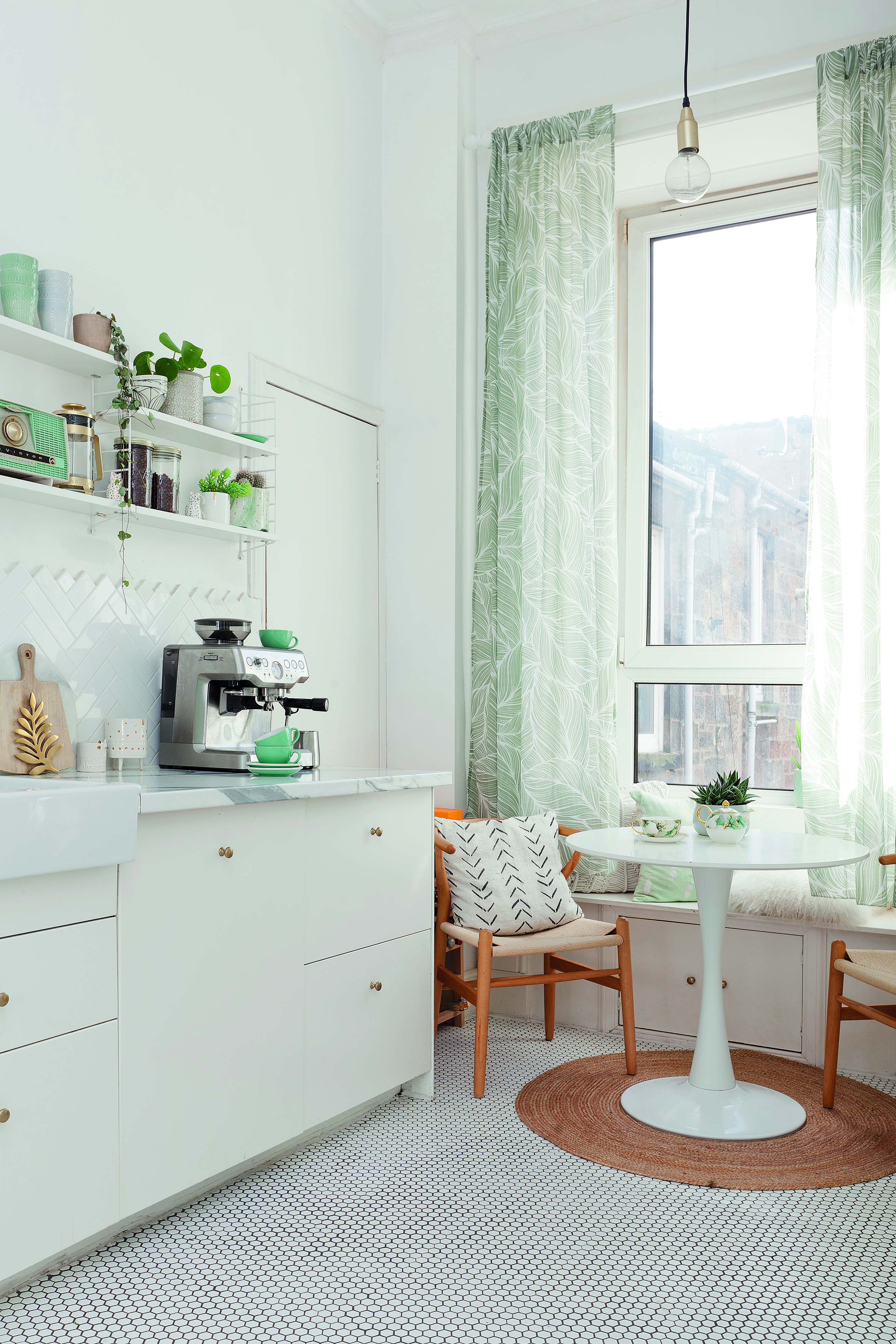 Home makeover: 'Our flat has bags of character!' Kate’s picture-perfect kitchen has open shelving and a handy larder for storage. The open shelving gives plenty of opportunity to show off her collection of kitchenware, from mugs and plates to potted houseplants