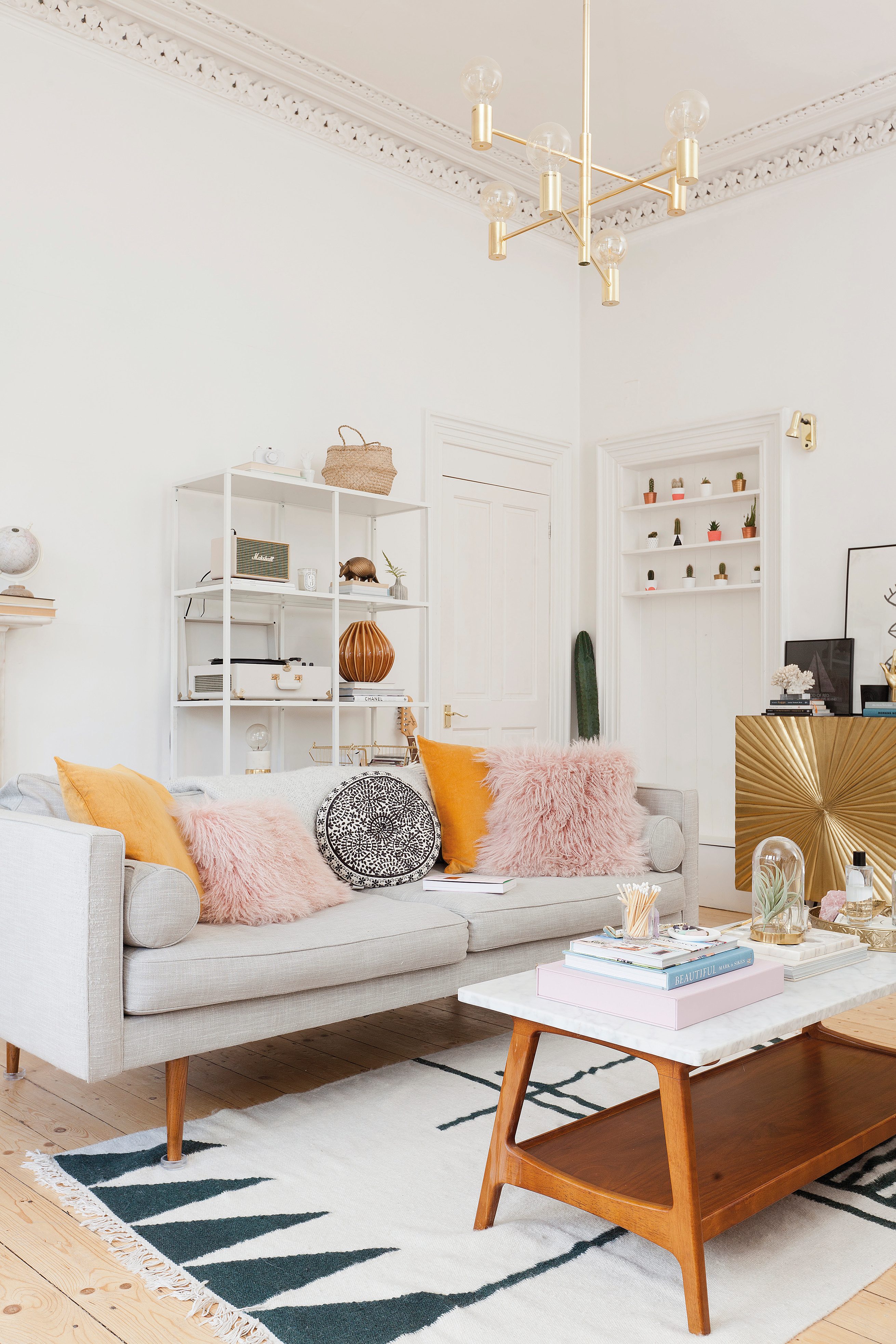Home makeover: 'Our flat has bags of character!' Regularly changing accessories in the living room allows for a quick and easy refresh. ‘While I’m tempted to buy new pieces to give the space a new lease of life,’ says Kate, ‘I know that having a switch up does the job just as well’