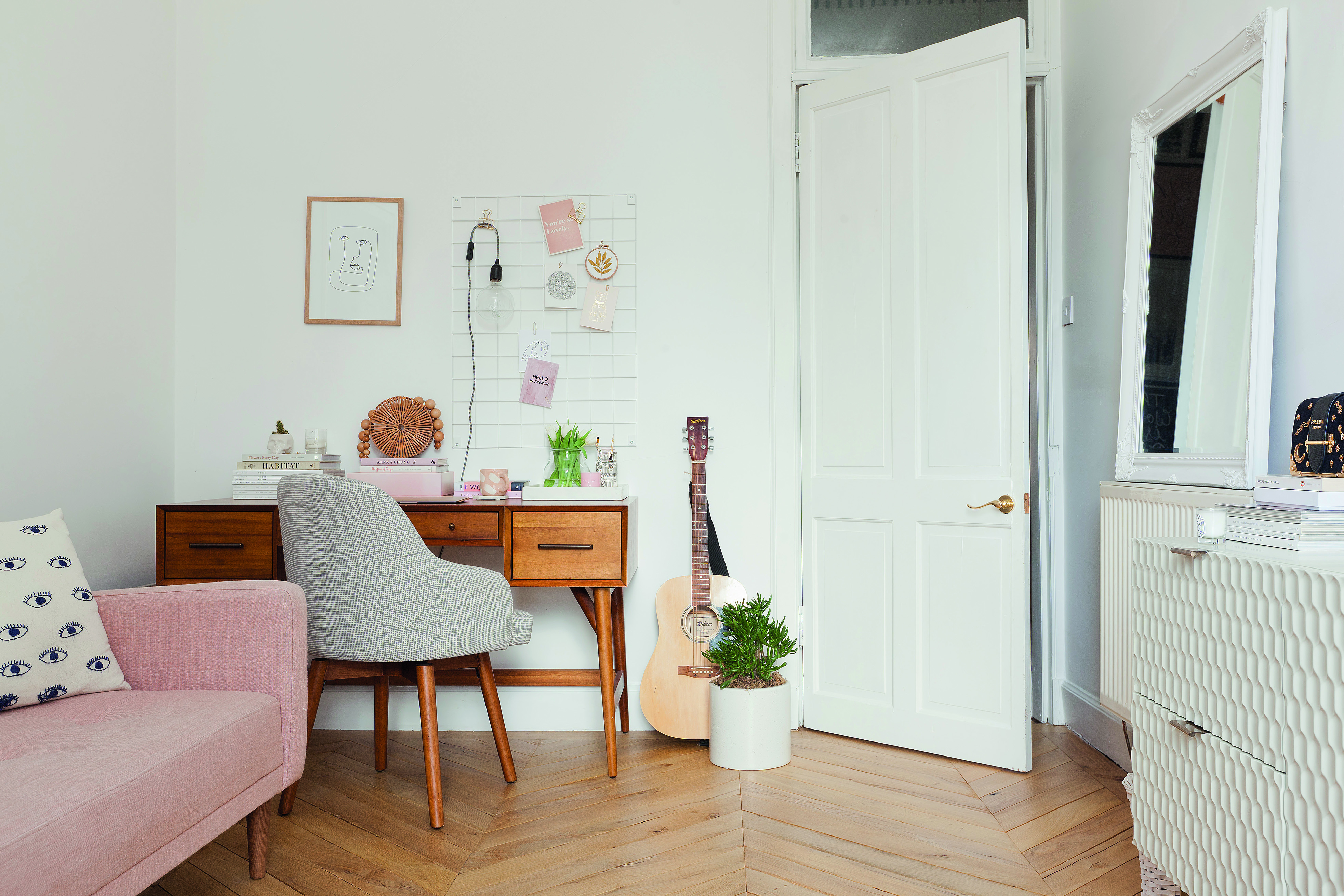 Home makeover: 'Our flat has bags of character!' Kate’s home office is a calm, mid- century-inspired space with vintage accents in the West Elm desk and Made.com sofa bed. The parquet-style flooring adds warmth to the room