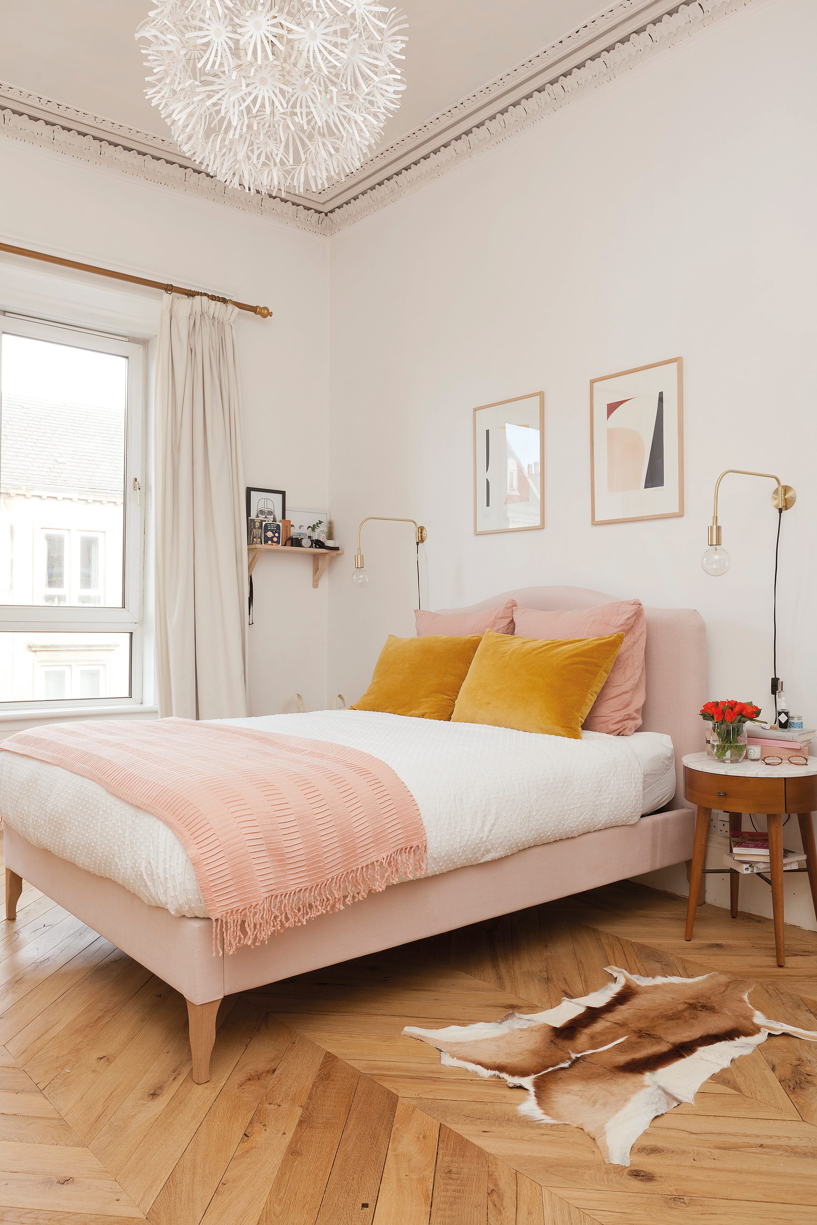Home makeover: 'Our flat has bags of character!' Kate wanted a mix of styles in her bedroom, which continues the muted colour scheme of her flat. The blush pink bed is from Made.com and the mid-century bedside tables are from West Elm