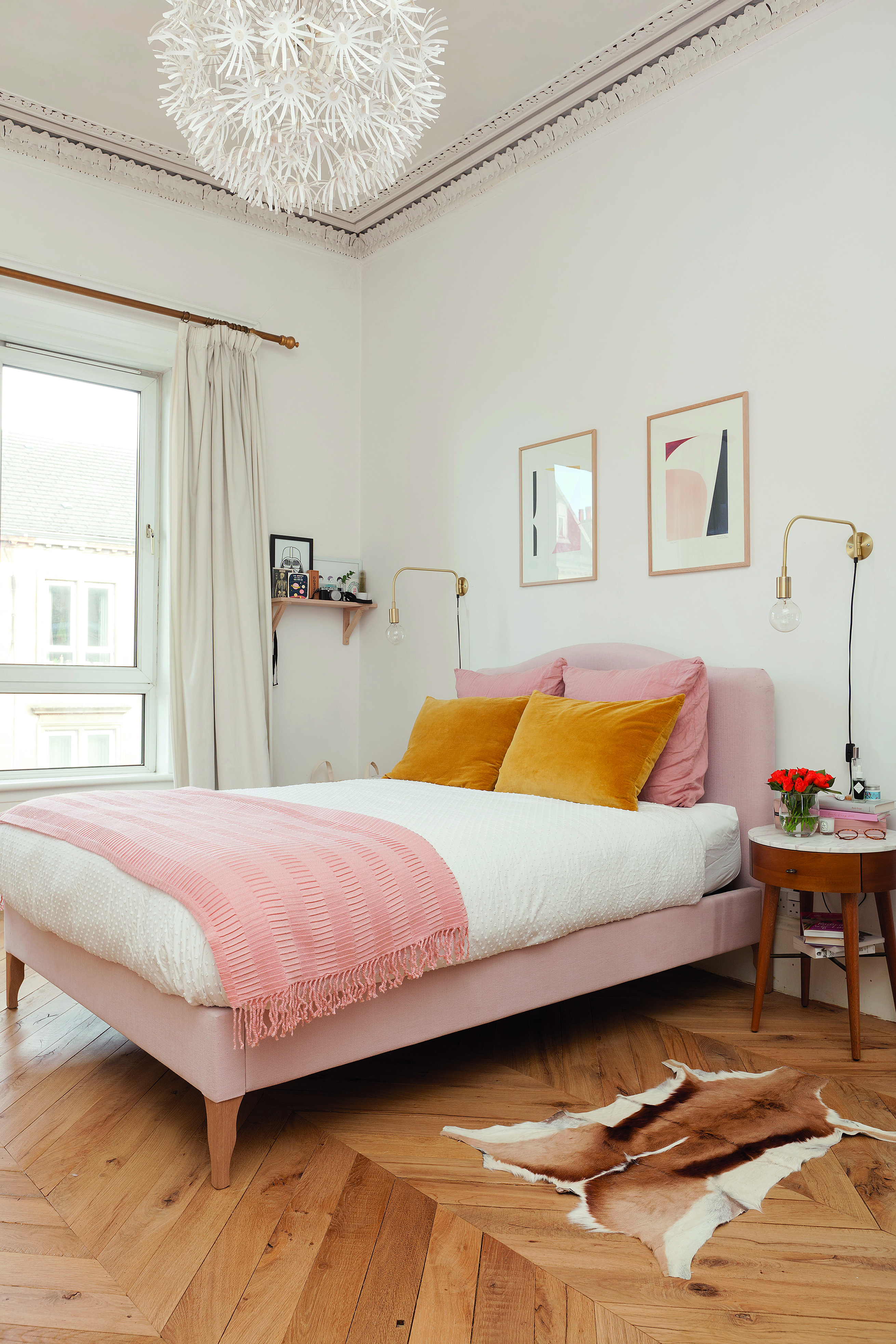 Home makeover: 'Our flat has bags of character!' Kate wanted a mix of styles in her bedroom, which continues the muted colour scheme of her flat. The blush pink bed is from Made.com and the mid-century bedside tables are from West Elm