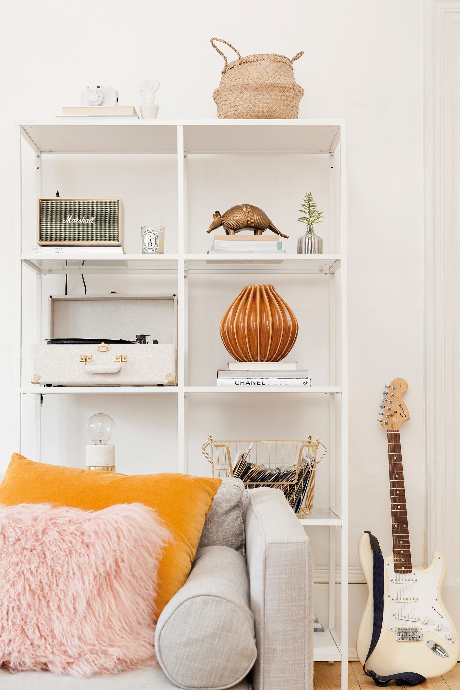 Home makeover: 'Our flat has bags of character!' Kate has displayed a variety of accessories, including a vintage record player from Urban Outfitters, on this open shelving unit