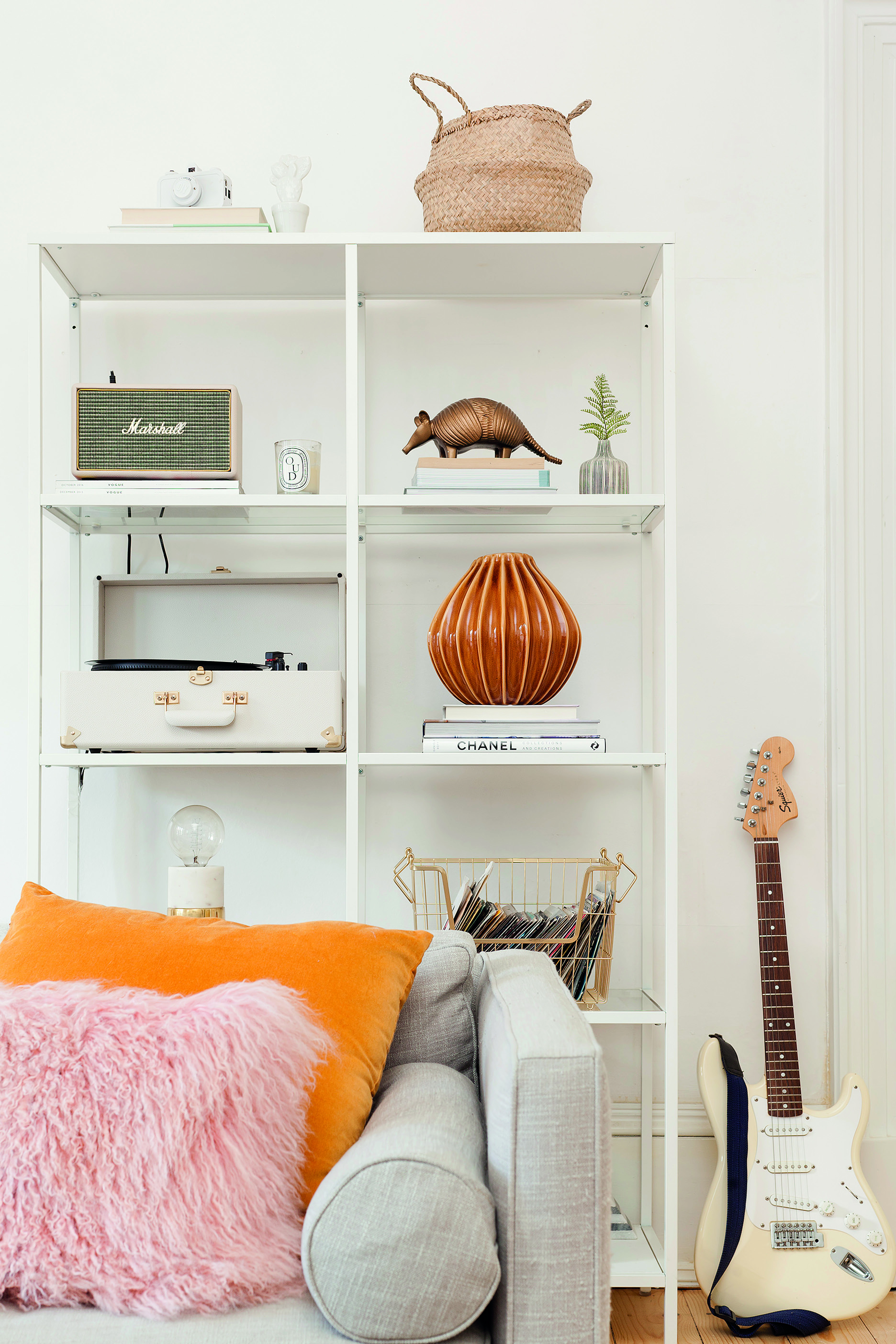 Home makeover: 'Our flat has bags of character!' Kate has displayed a variety of accessories, including a vintage record player from Urban Outfitters, on this open shelving unit