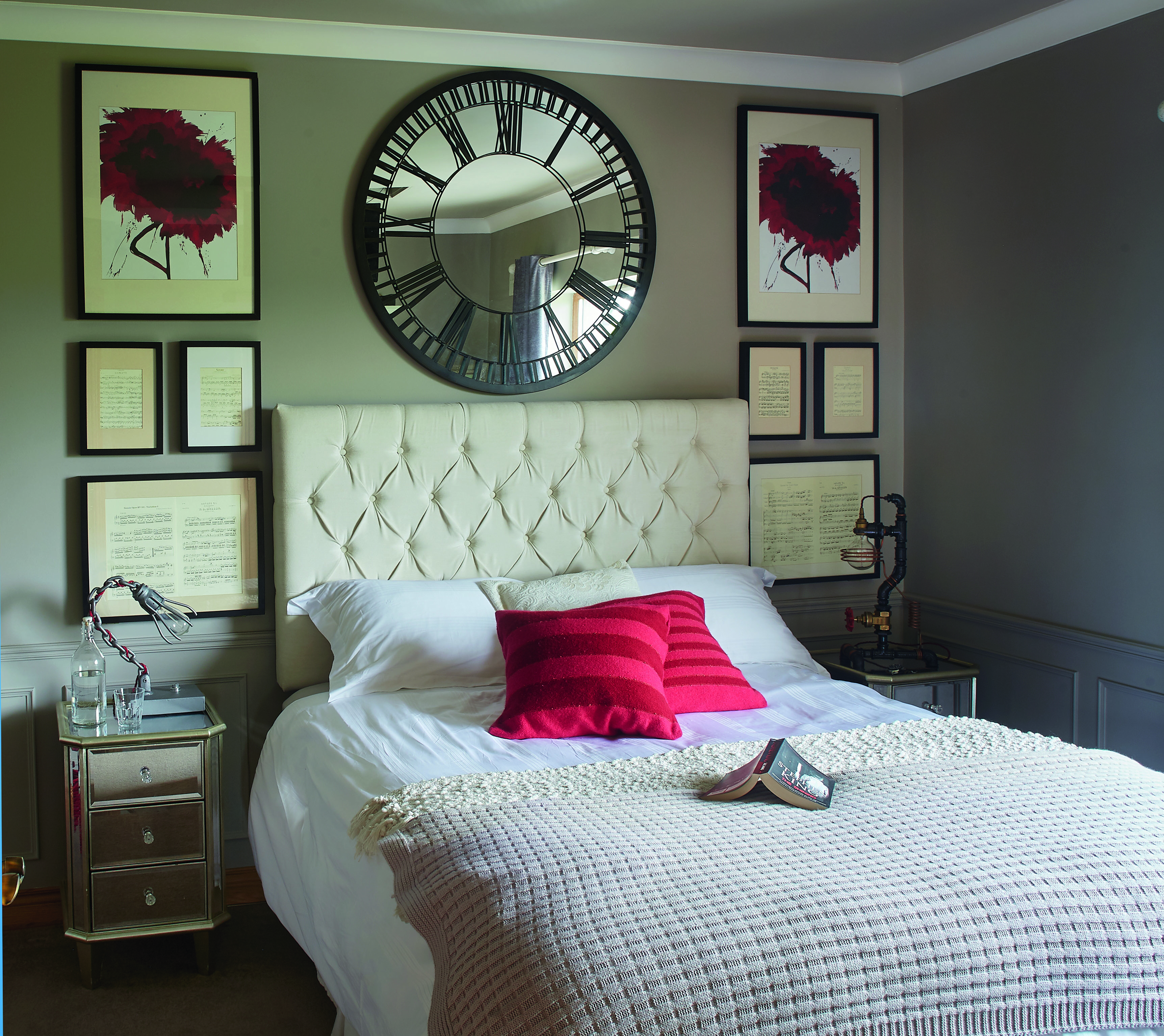 In the master bedroom, Shane made the bedside lamps and framed musical score around the bed. The mirror and the mirrored lockers are from Next, the walls are painted in Taupe from Colourtrend and the couple had the headboard made. The red cushions are from Avoca In the master bedroom, Shane made the bedside lamps and framed musical score around the bed. The mirror and the mirrored lockers are from Next, the walls are painted in Taupe from Colourtrend and the couple had the headboard made. The red cushions are from Avoca