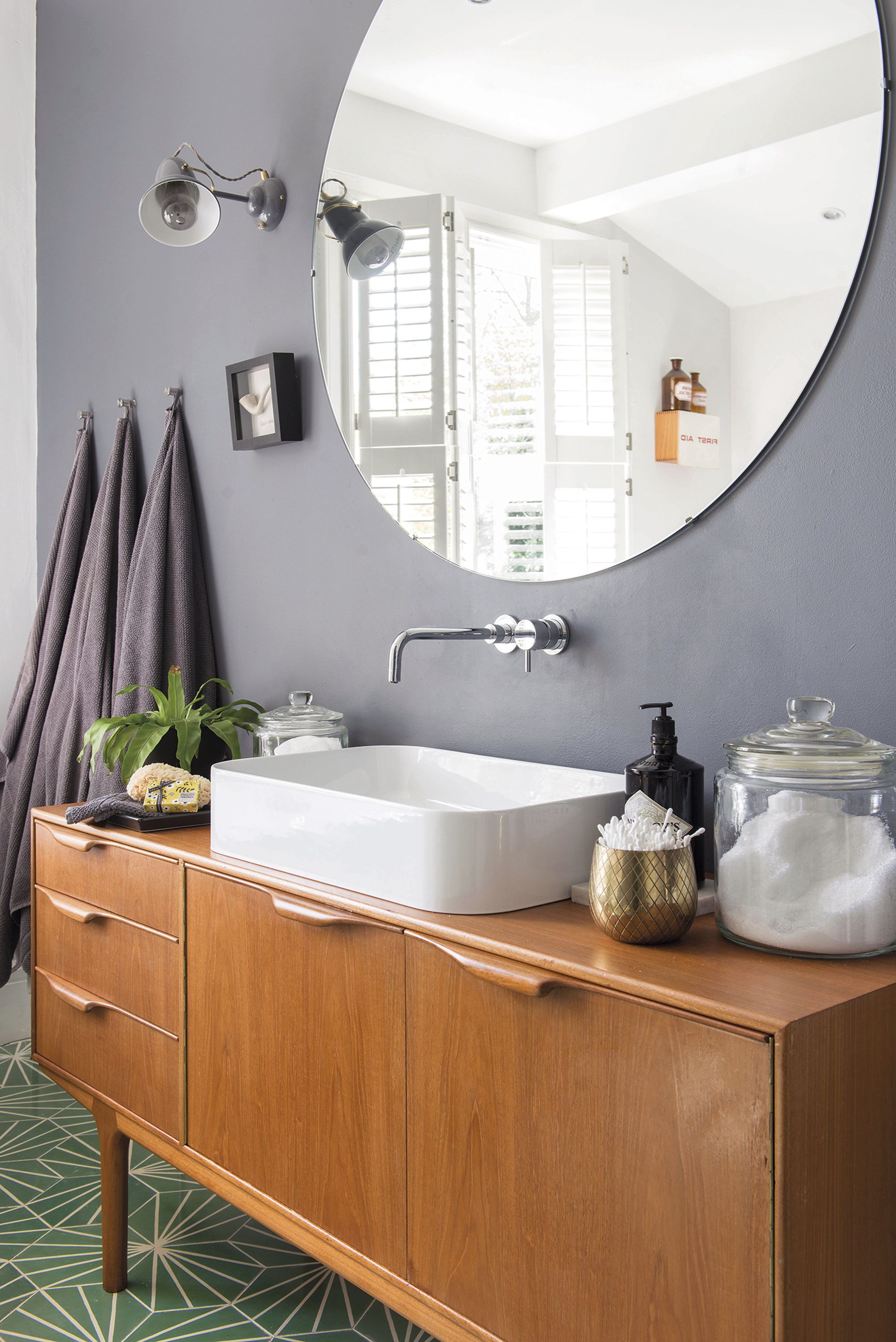 A large mirror from Leeds Glass helps to reflect light back into the space A large mirror from Leeds Glass helps to reflect light back into the space