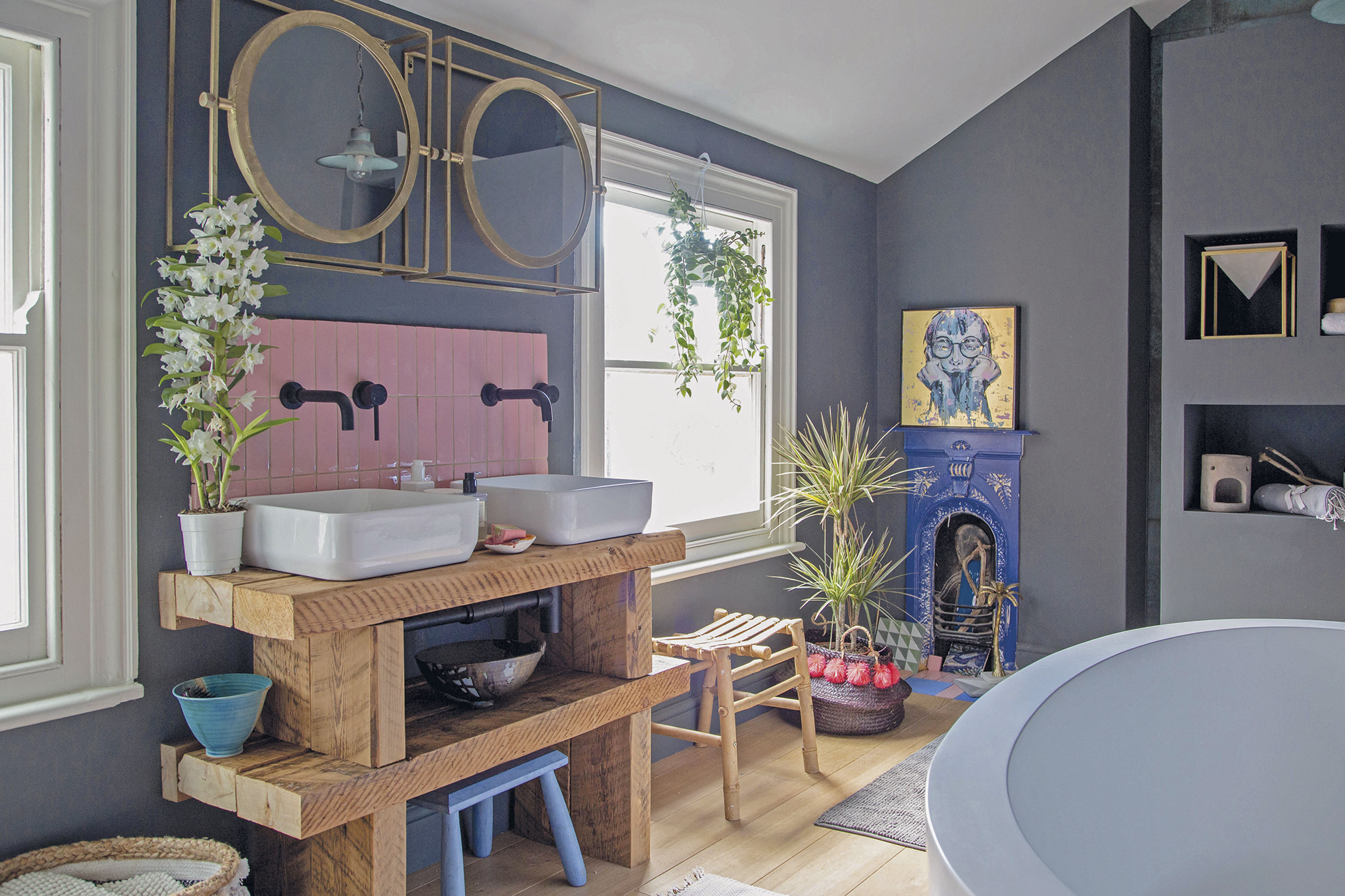 ‘Our builder made the shelves that our basins sit on using the old loft struts,’ says Megan. ‘So many people compliment us on them! The gorgeous, glossy pink tiles are from Bert & May,’ Megan shares. ‘It took hours of internet trawling to find the perfect tile in the right hue, but it was so worth it for the finished effect’ ‘Our builder made the shelves that our basins sit on using the old loft struts,’ says Megan. ‘So many people compliment us on them! The gorgeous, glossy pink tiles are from Bert & May,’ Megan shares. ‘It took hours of internet trawling to find the perfect tile in the right hue, but it was so worth it for the finished effect’
