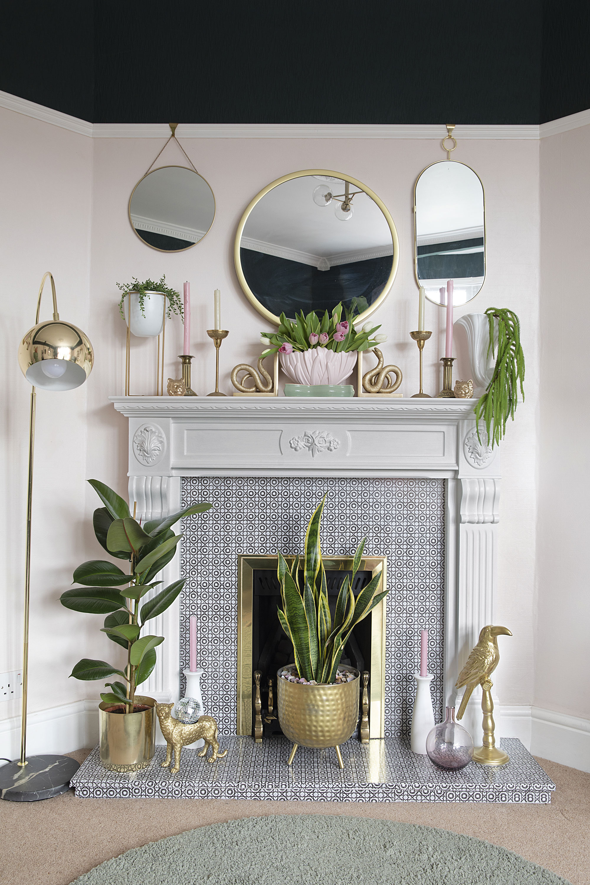 Painting the brown surround white and covering the marble back panel with £25 vinyl tile stickers has made a huge difference. ‘I chose a small-scale monochrome design so it wasn’t too overpowering and would go with anything,’ says Leanne. Gold touches, like the Next floor lamp and mirrors from Matalan and Dunelm, add a luxe edge Painting the brown surround white and covering the marble back panel with £25 vinyl tile stickers has made a huge difference. ‘I chose a small-scale monochrome design so it wasn’t too overpowering and would go with anything,’ says Leanne. Gold touches, like the Next floor lamp and mirrors from Matalan and Dunelm, add a luxe edge