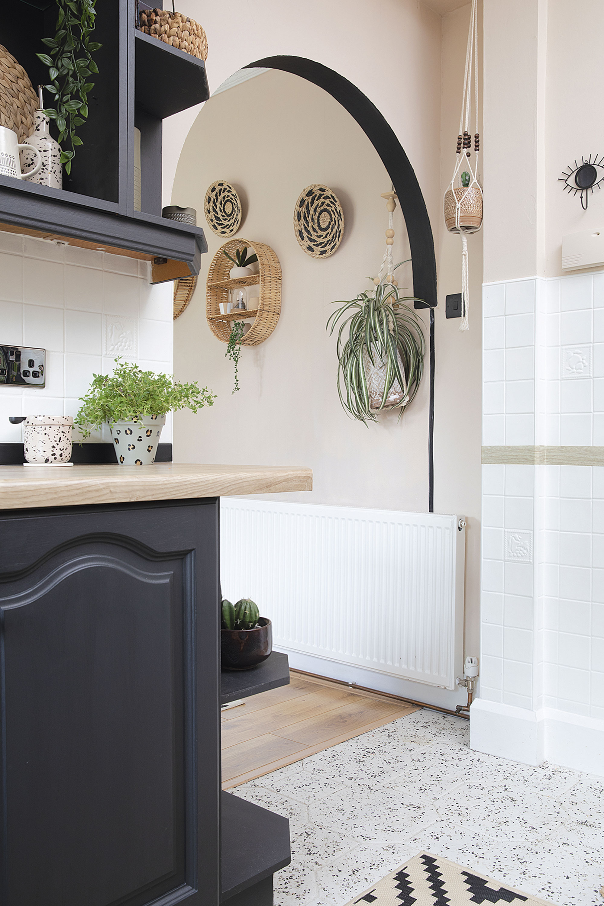 In future, the couple might knock through to the dining room, but for now they’ve dressed the space with a rattan shelf from Matalan and boho wall-mounted bowls from B&M In future, the couple might knock through to the dining room, but for now they’ve dressed the space with a rattan shelf from Matalan and boho wall-mounted bowls from B&M