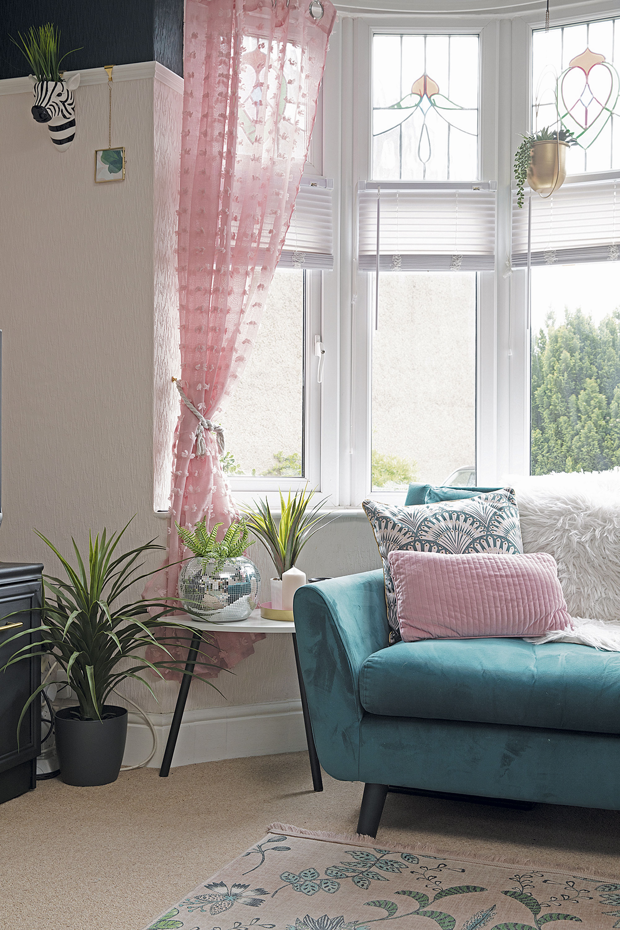 Pink voile curtains from The Range allow plenty of light in. ‘Most stained-glass windows have traditional colours, but these pink and pale blue ones are special,’ says Leanne. ‘They’re one of my favourite things in the house’ Pink voile curtains from The Range allow plenty of light in. ‘Most stained-glass windows have traditional colours, but these pink and pale blue ones are special,’ says Leanne. ‘They’re one of my favourite things in the house’