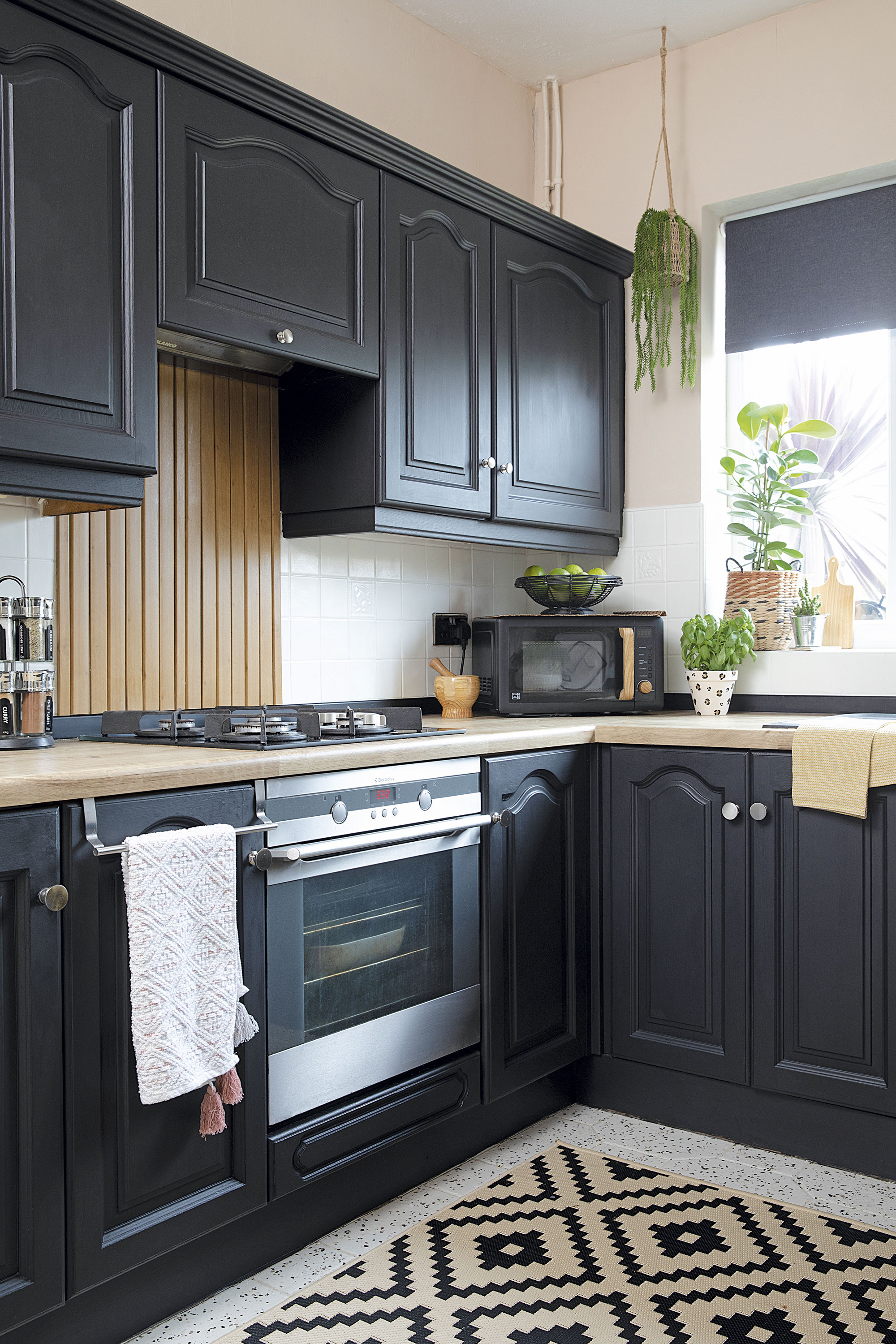 Two coats of Frenchic Blackjack chalk paint have transformed the brown kitchen. ‘It didn’t need priming or sealing so it was really easy to do,’ says Leanne. A monochrome geometric rug from Dunelm finishes off the space Two coats of Frenchic Blackjack chalk paint have transformed the brown kitchen. ‘It didn’t need priming or sealing so it was really easy to do,’ says Leanne. A monochrome geometric rug from Dunelm finishes off the space