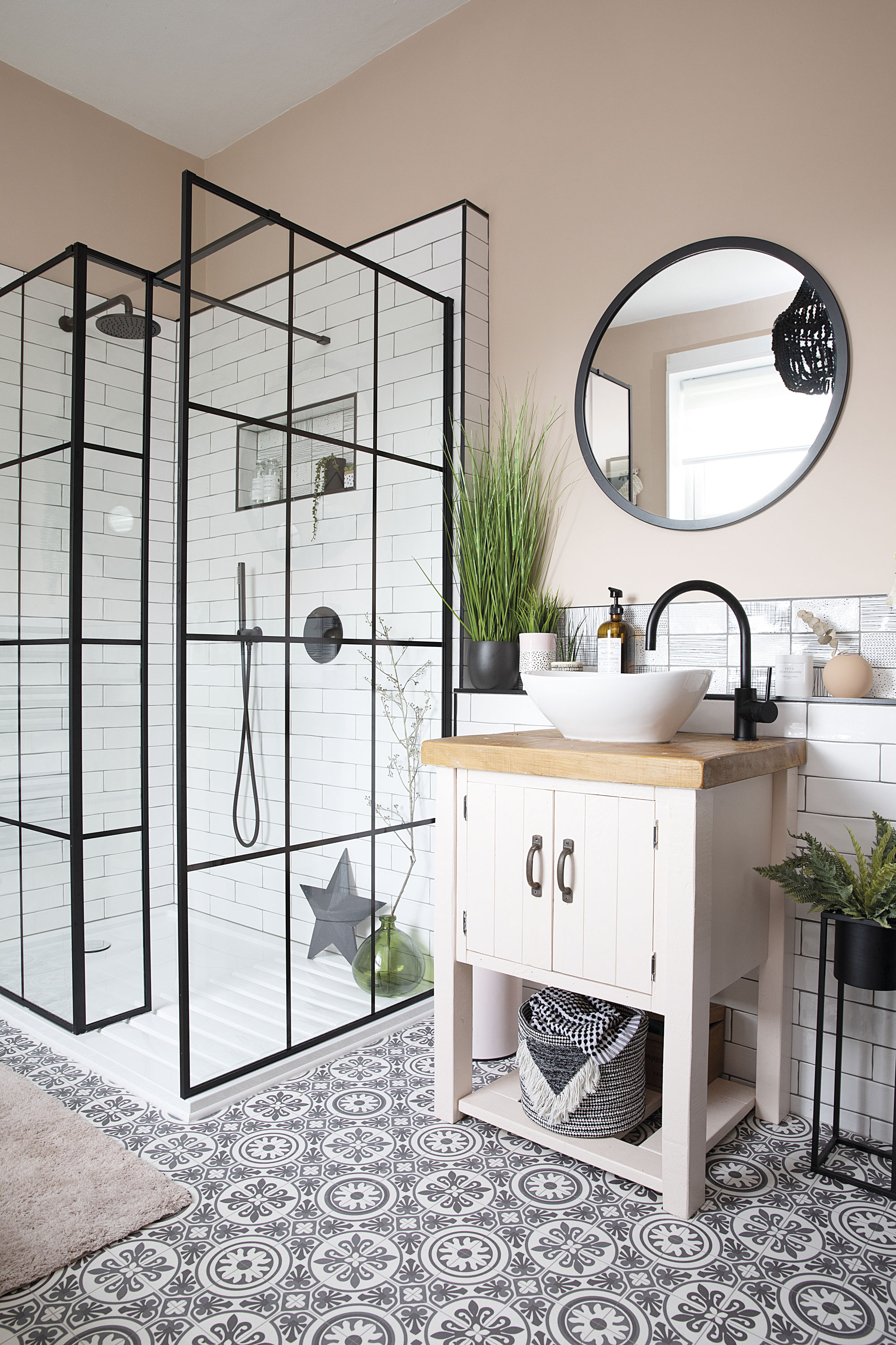 A false wall was built out so Liz could have an inset shelf in the shower and a ledge behind the sink for toiletries. The bold black beaded chandelier – just seen in the mirror – pulls the room’s scheme together A false wall was built out so Liz could have an inset shelf in the shower and a ledge behind the sink for toiletries. The bold black beaded chandelier – just seen in the mirror – pulls the room’s scheme together