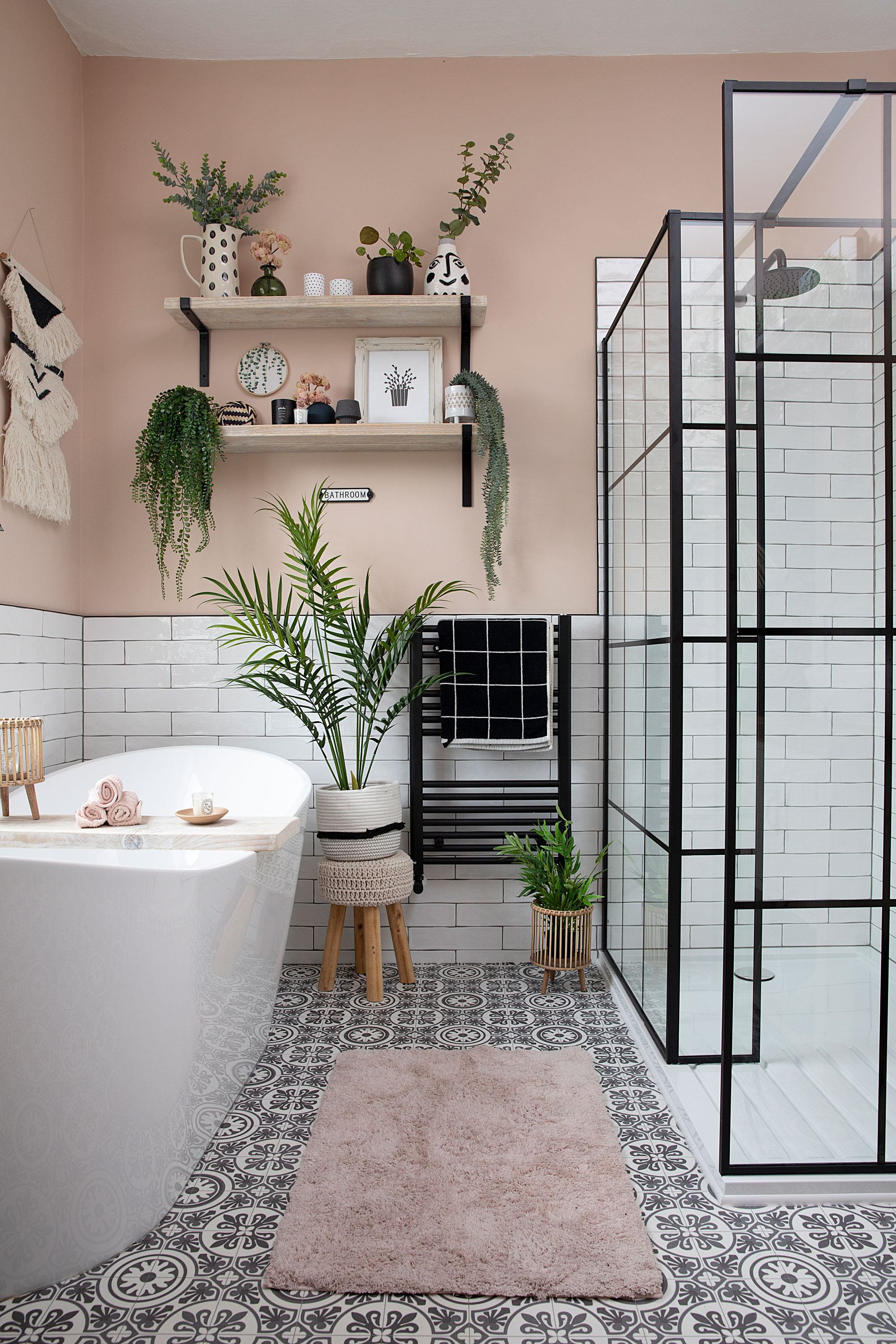 The previous room layout featured both a bath and cramped shower along the back wall with partition in-between. Moving the bath under the window has unlocked the space’s potential The previous room layout featured both a bath and cramped shower along the back wall with partition in-between. Moving the bath under the window has unlocked the space’s potential