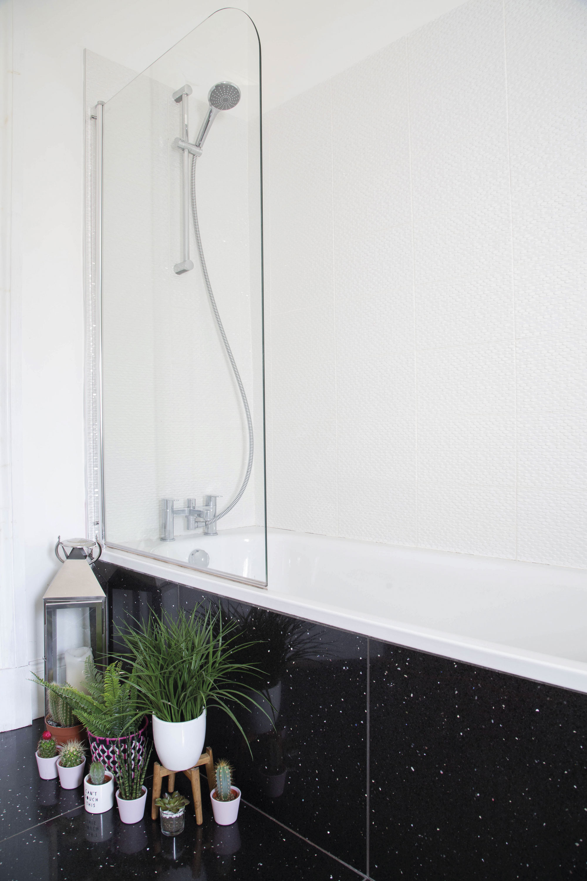 Lesley chose white Porcelanosa tiles, which were in the sale, for around the bath and sink, giving a fresh, clean feel for the bathroom Lesley chose white Porcelanosa tiles, which were in the sale, for around the bath and sink, giving a fresh, clean feel for the bathroom
