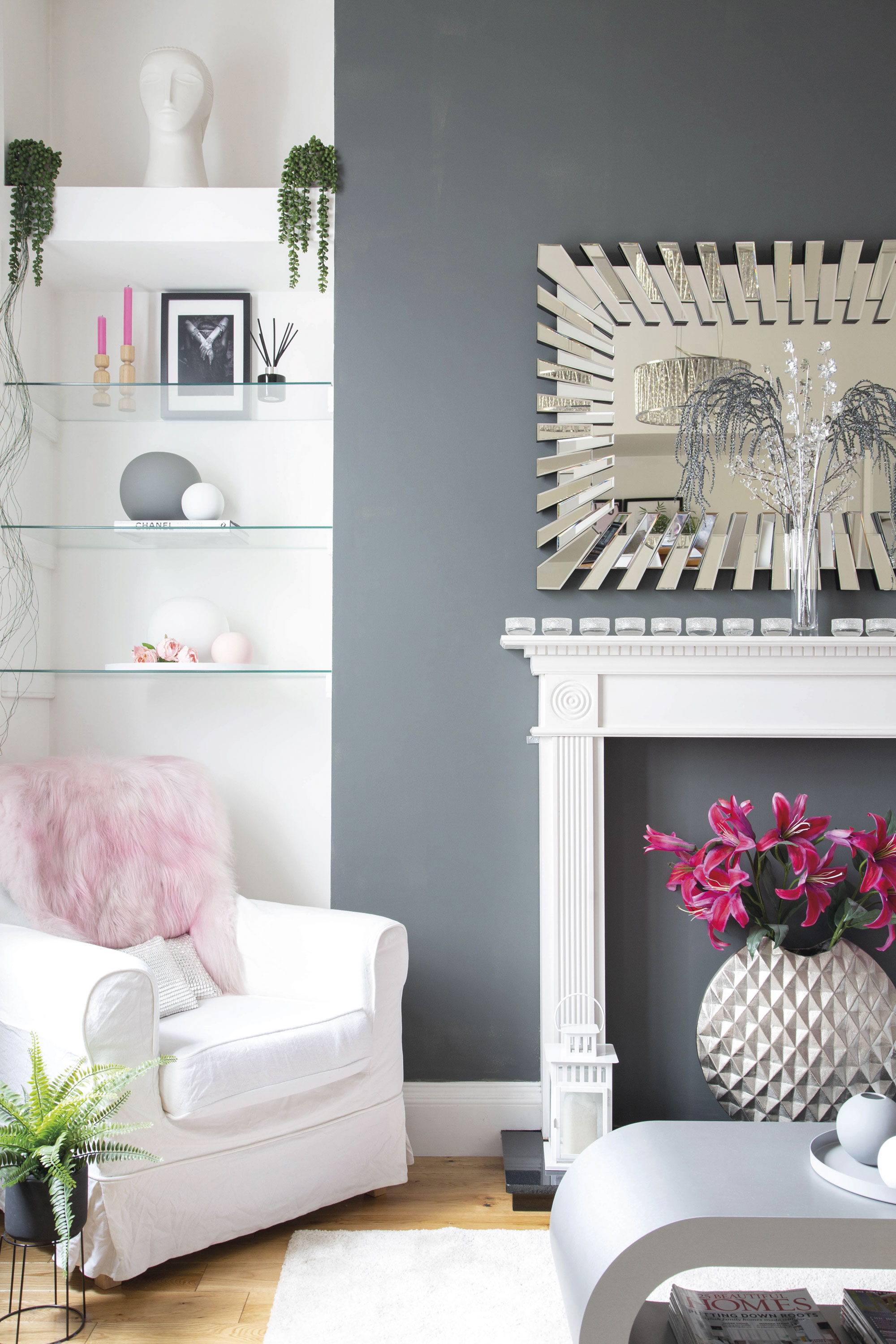 Lesley’s pared-back white and grey palette in the living room allows her to get creative with artwork and accessories Lesley’s pared-back white and grey palette in the living room allows her to get creative with artwork and accessories