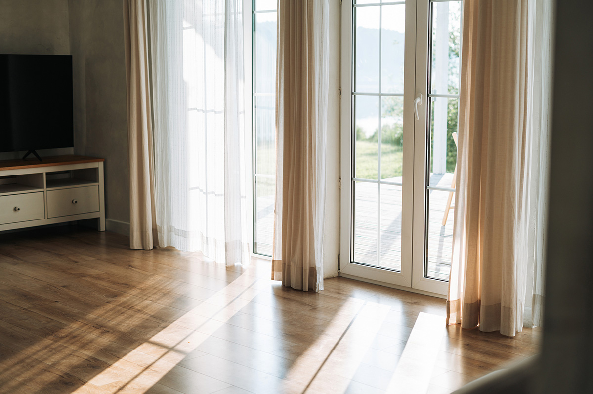 Beautiful morning light through curtains in the living room at home