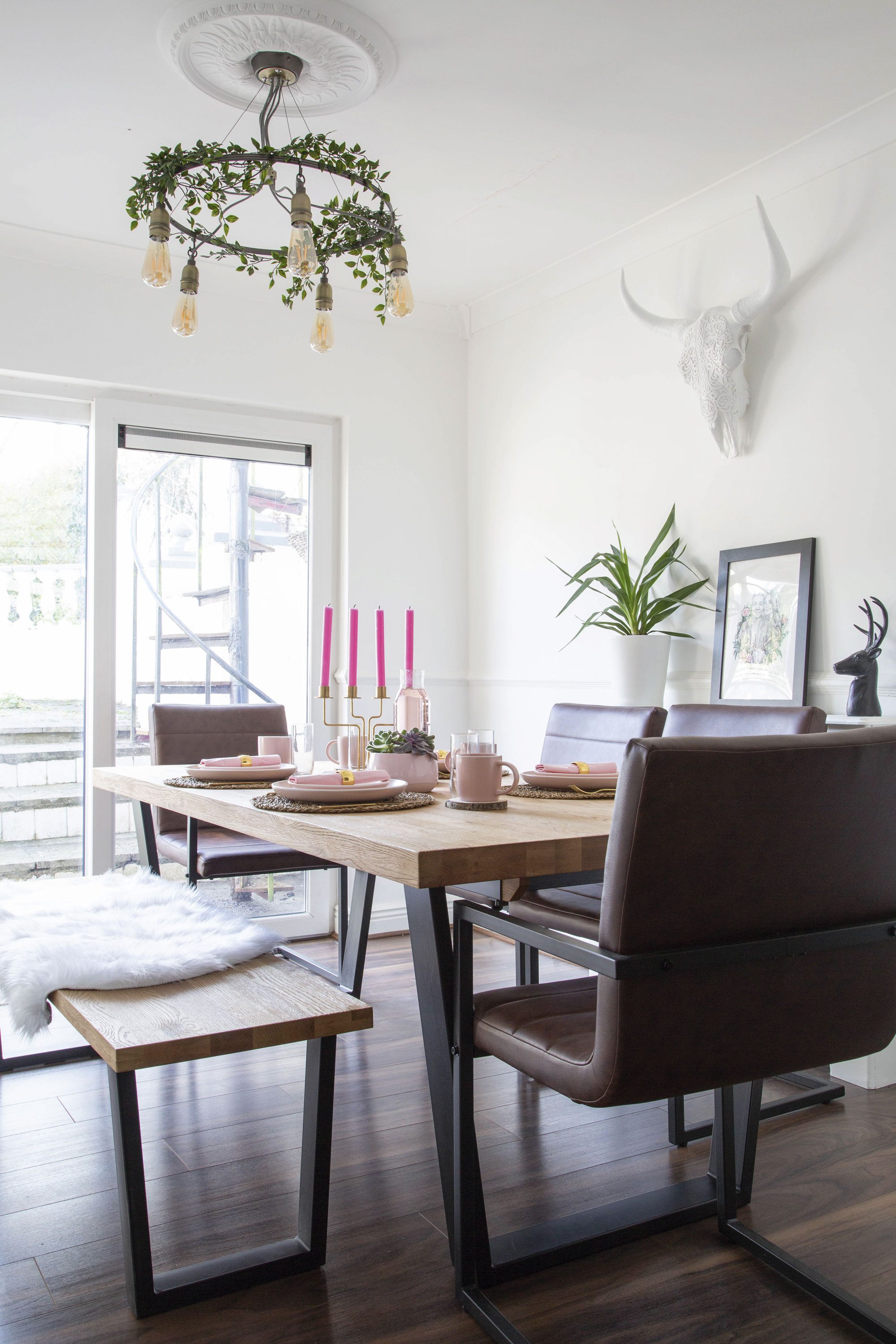 Formerly purple, with uneven floors and a leak in the ceiling, ‘the dining room was extremely dark when we first bought the house,’ Lynn says, ‘so we painted it white. Now, light enters the large patio doors and bounces off the walls to create a bright space. We also had to get a new roof and insulation, but it made the whole ground floor so much warmer’ Formerly purple, with uneven floors and a leak in the ceiling, ‘the dining room was extremely dark when we first bought the house,’ Lynn says, ‘so we painted it white. Now, light enters the large patio doors and bounces off the walls to create a bright space. We also had to get a new roof and insulation, but it made the whole ground floor so much warmer’