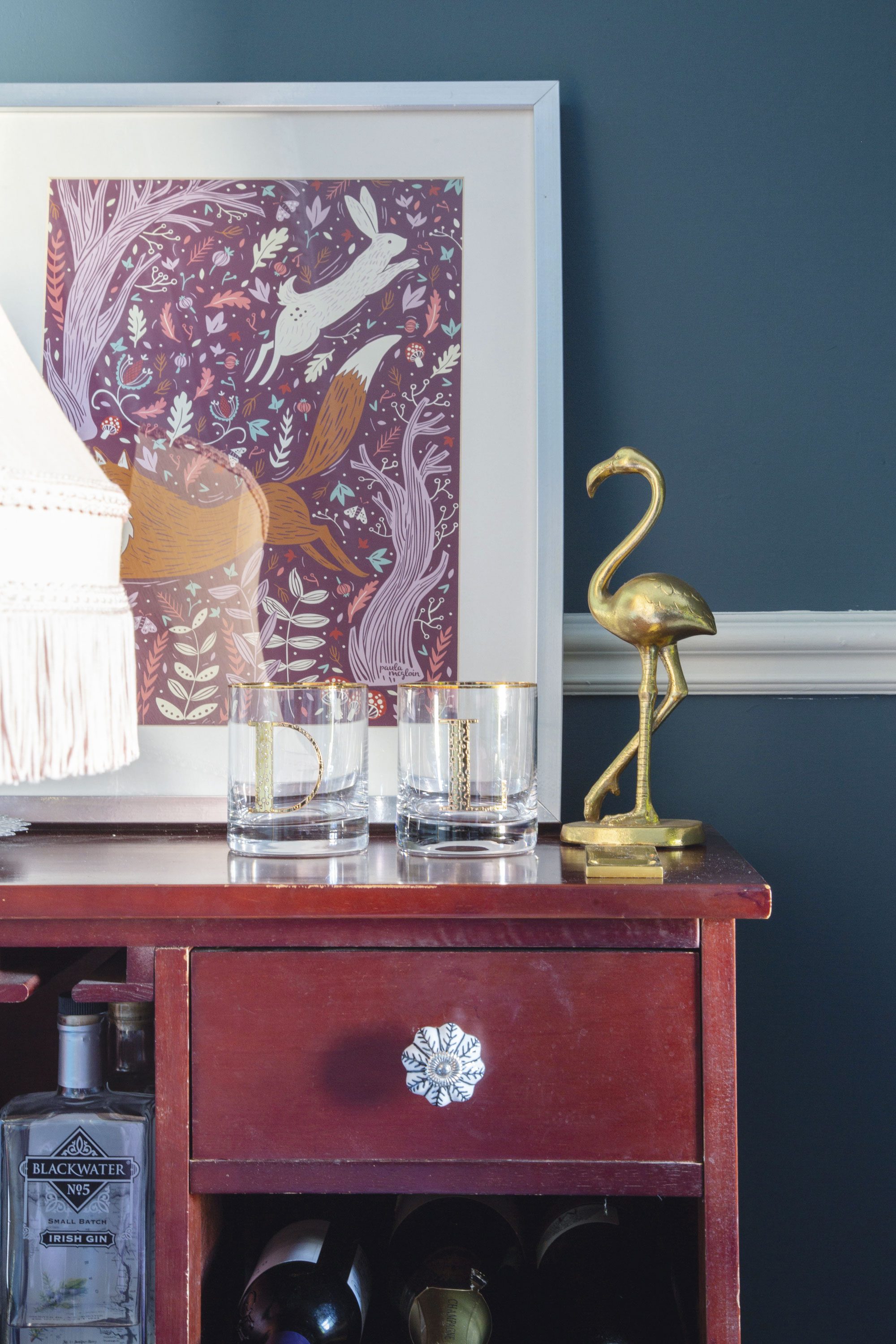 ‘The bar cart was my husband’s grandmother’s,’ Lynn shares. ‘We were thinking about painting it, but I actually quite like the reddish tone of the original stain on it, so we just added new handles’ ‘The bar cart was my husband’s grandmother’s,’ Lynn shares. ‘We were thinking about painting it, but I actually quite like the reddish tone of the original stain on it, so we just added new handles’