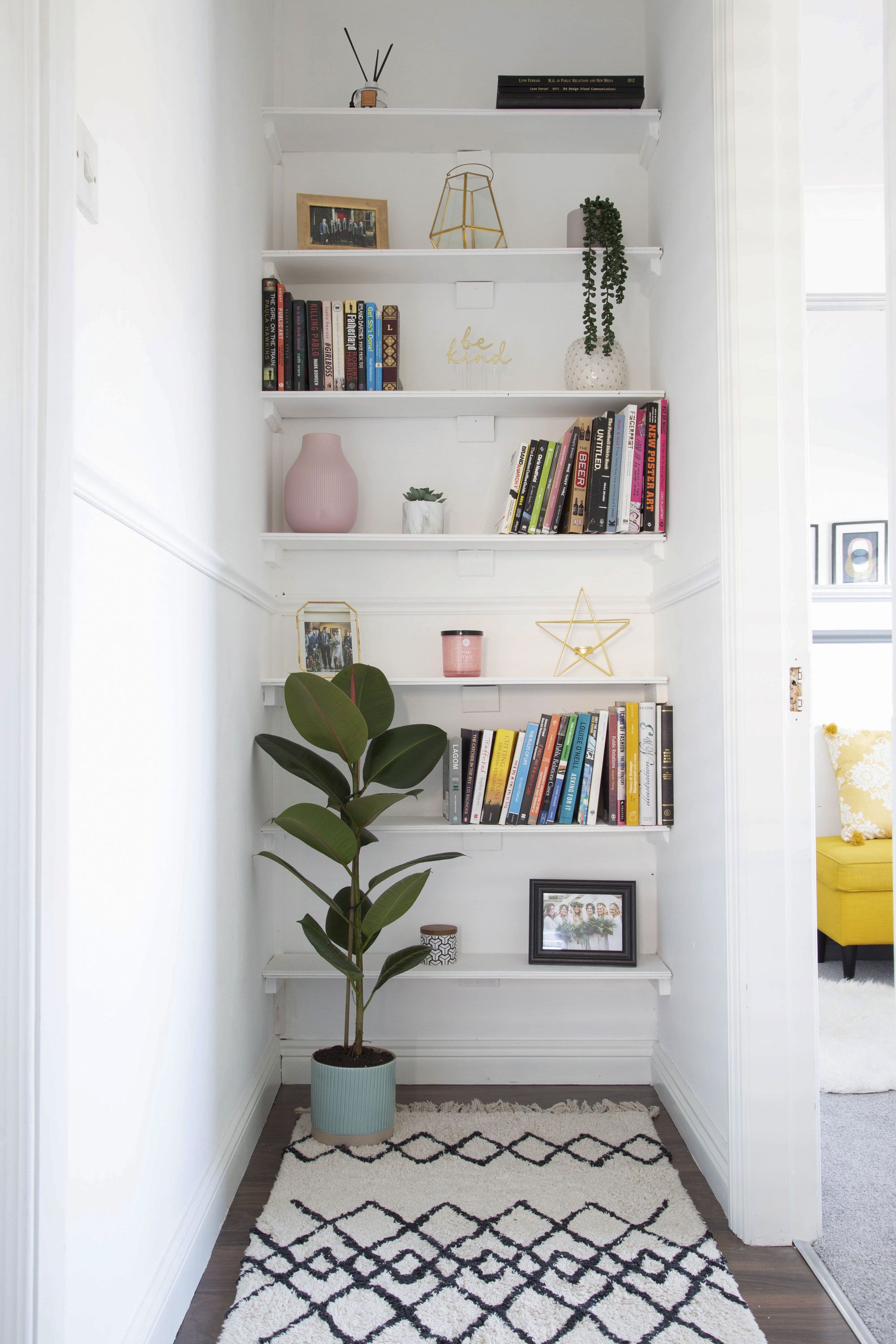 Lynn has made a feature of this corner, which could easily have gone unused, with simple shelving and a tall plant Lynn has made a feature of this corner, which could easily have gone unused, with simple shelving and a tall plant
