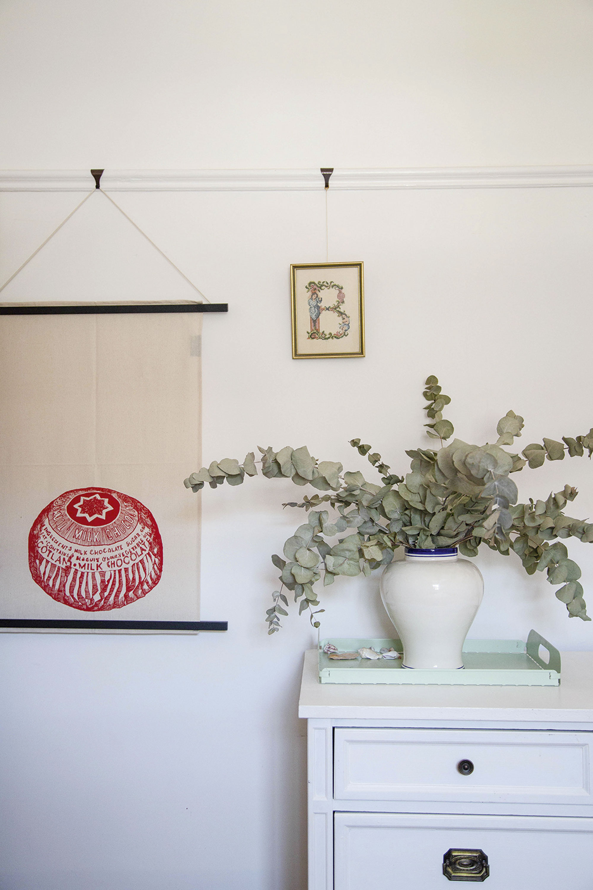 Artwork doesn’t have to be expensive. Vicky used a poster frame to turn a £4 tea towel from TK Maxx into wall art for a splash of colour