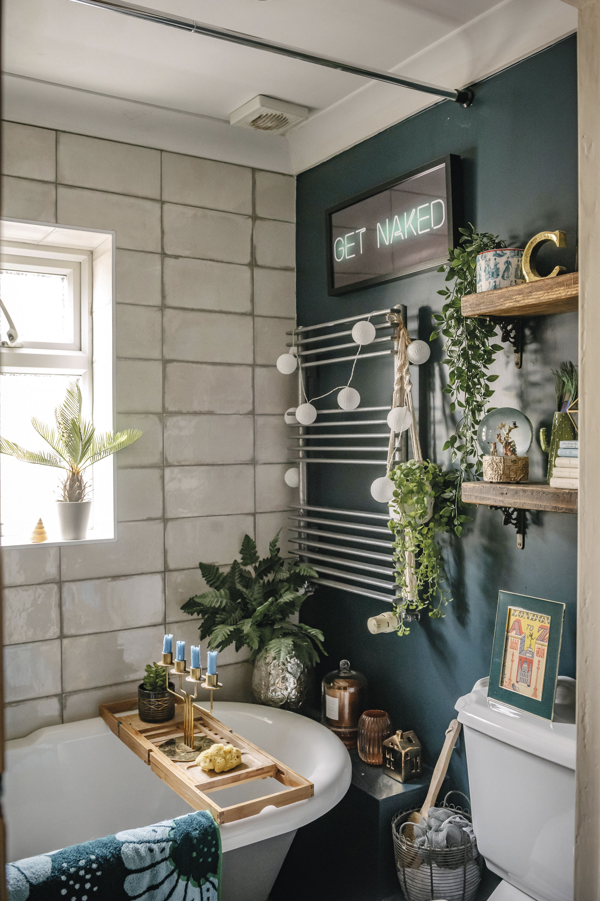 Lily chose Farrow & Ball’s Hague Blue for the bathroom walls and used floral paper leftover from the kitchen. The shelves were made from reclaimed wood and the brackets were vintage buys from eBay Lily chose Farrow & Ball’s Hague Blue for the bathroom walls and used floral paper leftover from the kitchen. The shelves were made from reclaimed wood and the brackets were vintage buys from eBay