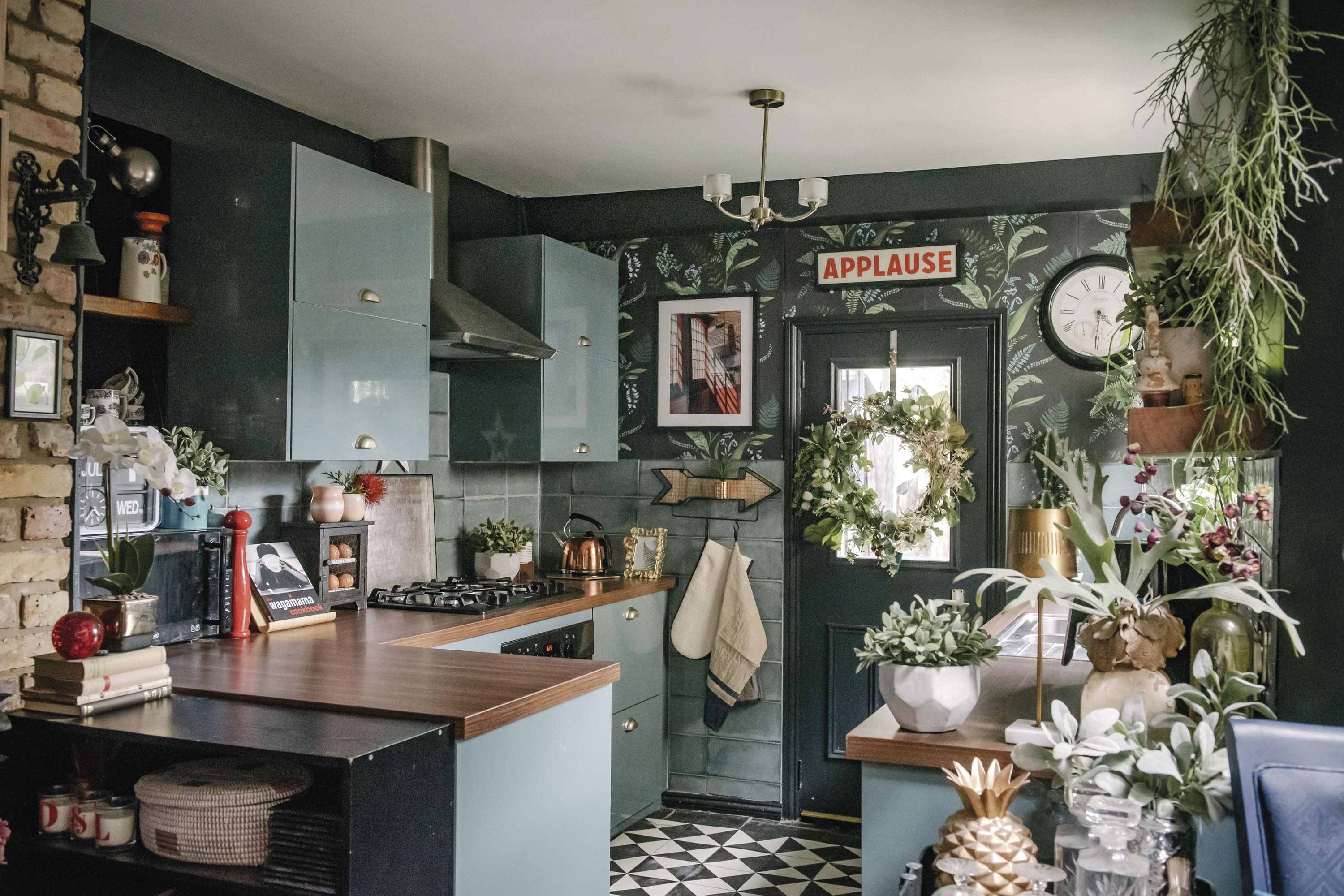 ‘Previously, the kitchen had cream melamine cupboards and a black mottled worktop. I hated it,’ Lily recalls. ‘We renovated in 2017 and opted for IKEA cabinetry with high-gloss doors as the room is so dark, and easy-care laminate worktops. We hung decorative floral paper along one wall for a fun finish.’ ‘Previously, the kitchen had cream melamine cupboards and a black mottled worktop. I hated it,’ Lily recalls. ‘We renovated in 2017 and opted for IKEA cabinetry with high-gloss doors as the room is so dark, and easy-care laminate worktops. We hung decorative floral paper along one wall for a fun finish.’