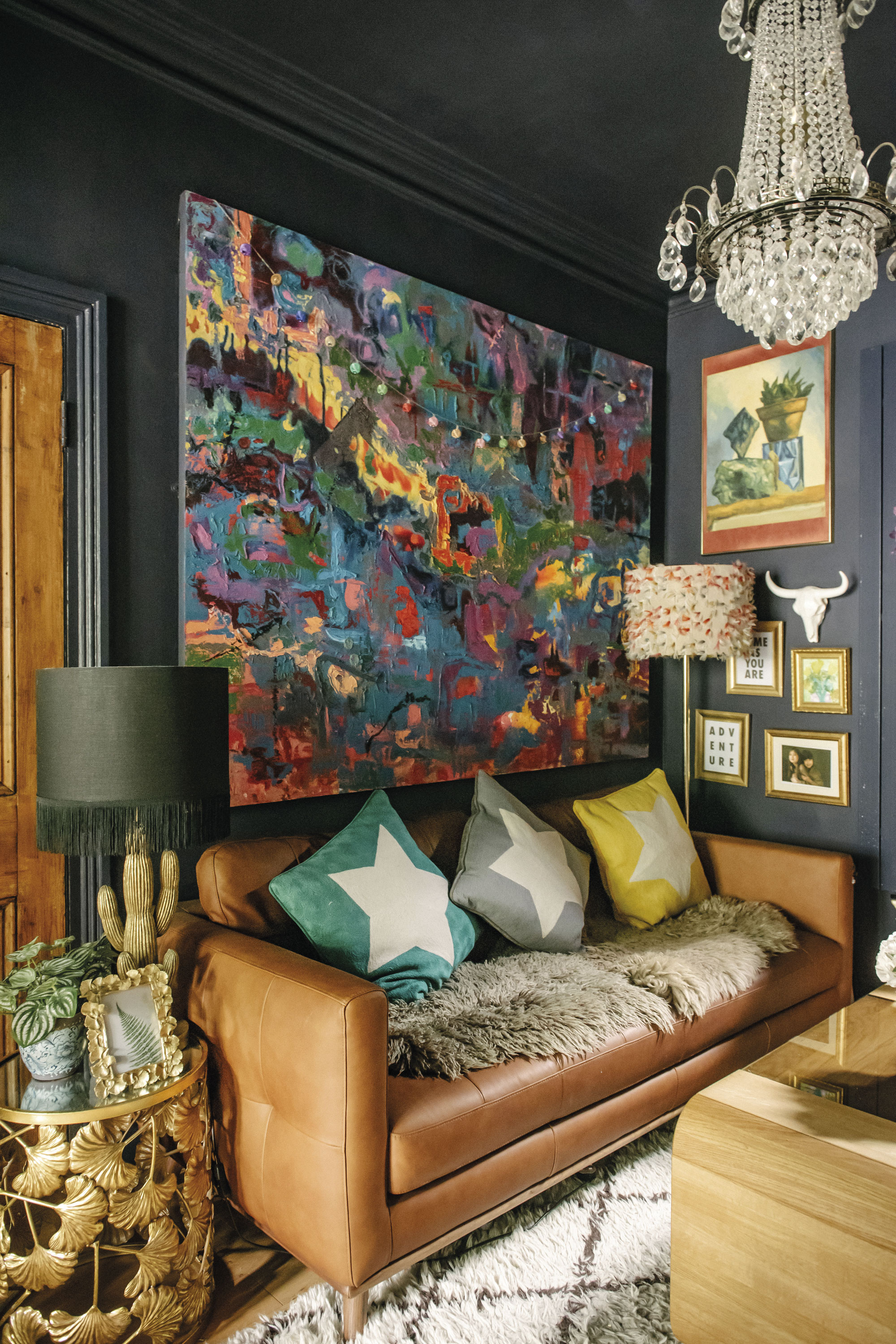 living2 The front room is a snug-meets-studio. By day, it’s where Lily takes photographs and in the evenings it’s where the family cosies up by the log burner. The mustard and deep green scheme gives the space a warm feeling