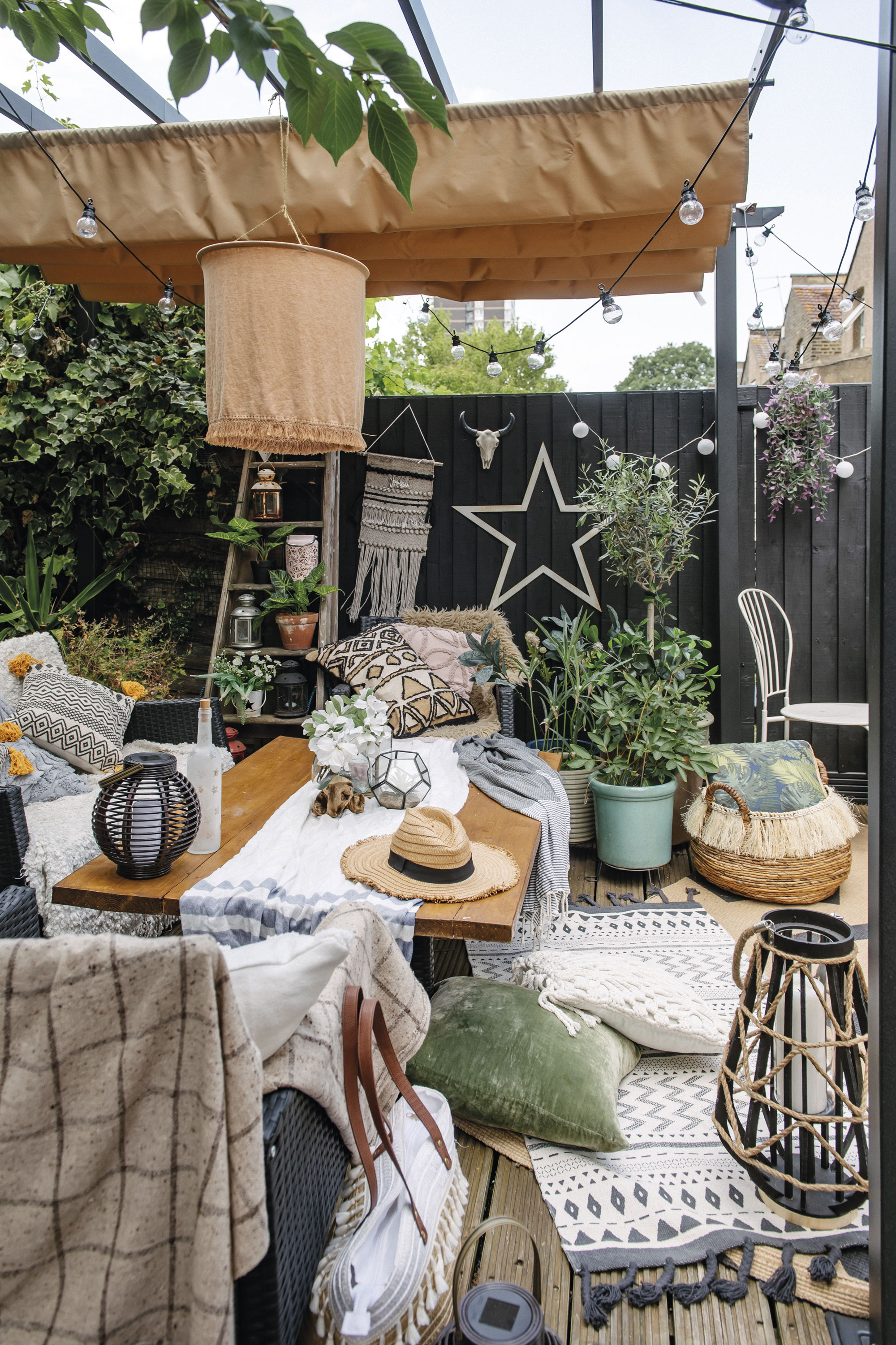 Lily has utilised outside space to create an additional room to relax in. Layers upon layers of texture help to make this makeshift scheme incredibly cosy, even on autumnal days Lily has utilised outside space to create an additional room to relax in. Layers upon layers of texture help to make this makeshift scheme incredibly cosy, even on autumnal days