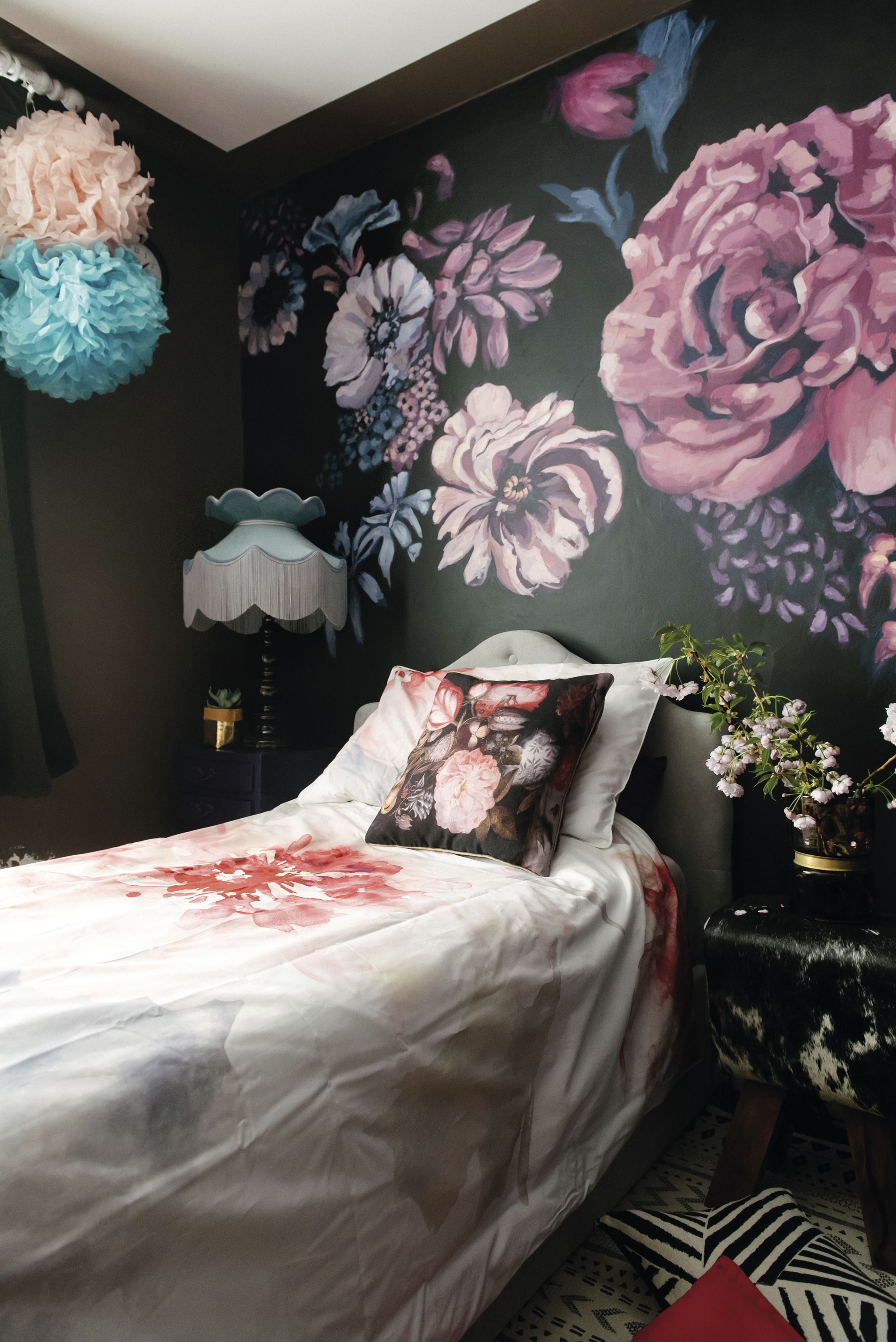 ‘I painted the mural using Frenchic paint,’ says Lily. ‘This room gets lots of sunlight, so I wanted it to have a nostalgic holiday feel with florals and blush pink tones.’ ‘I painted the mural using Frenchic paint,’ says Lily. ‘This room gets lots of sunlight, so I wanted it to have a nostalgic holiday feel with florals and blush pink tones.’