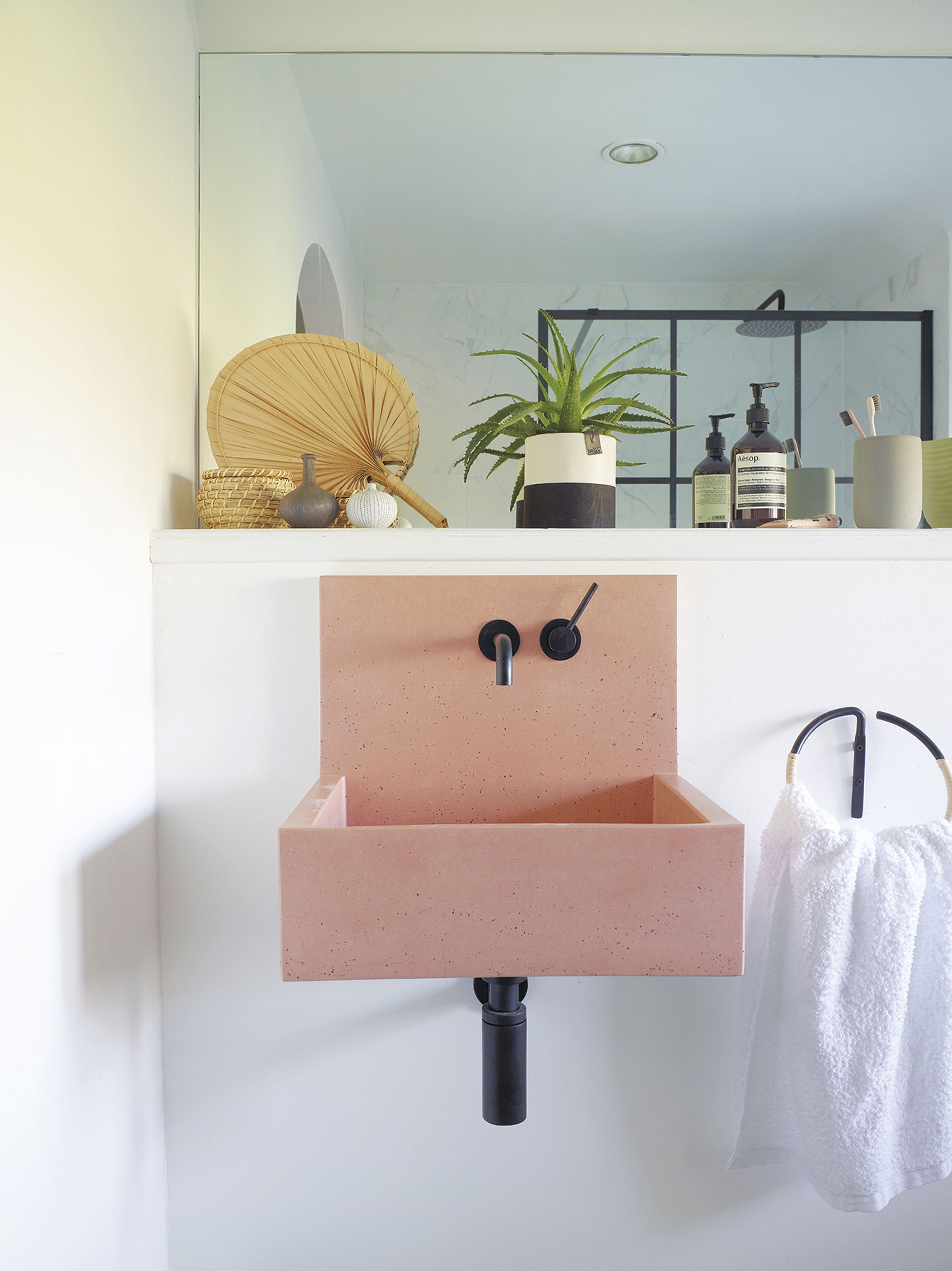 The design of Hayley’s en suite centres on her pink Kast basin, with its clean lines and Scandi-inspired design The design of Hayley’s en suite centres on her pink Kast basin, with its clean lines and Scandi-inspired design