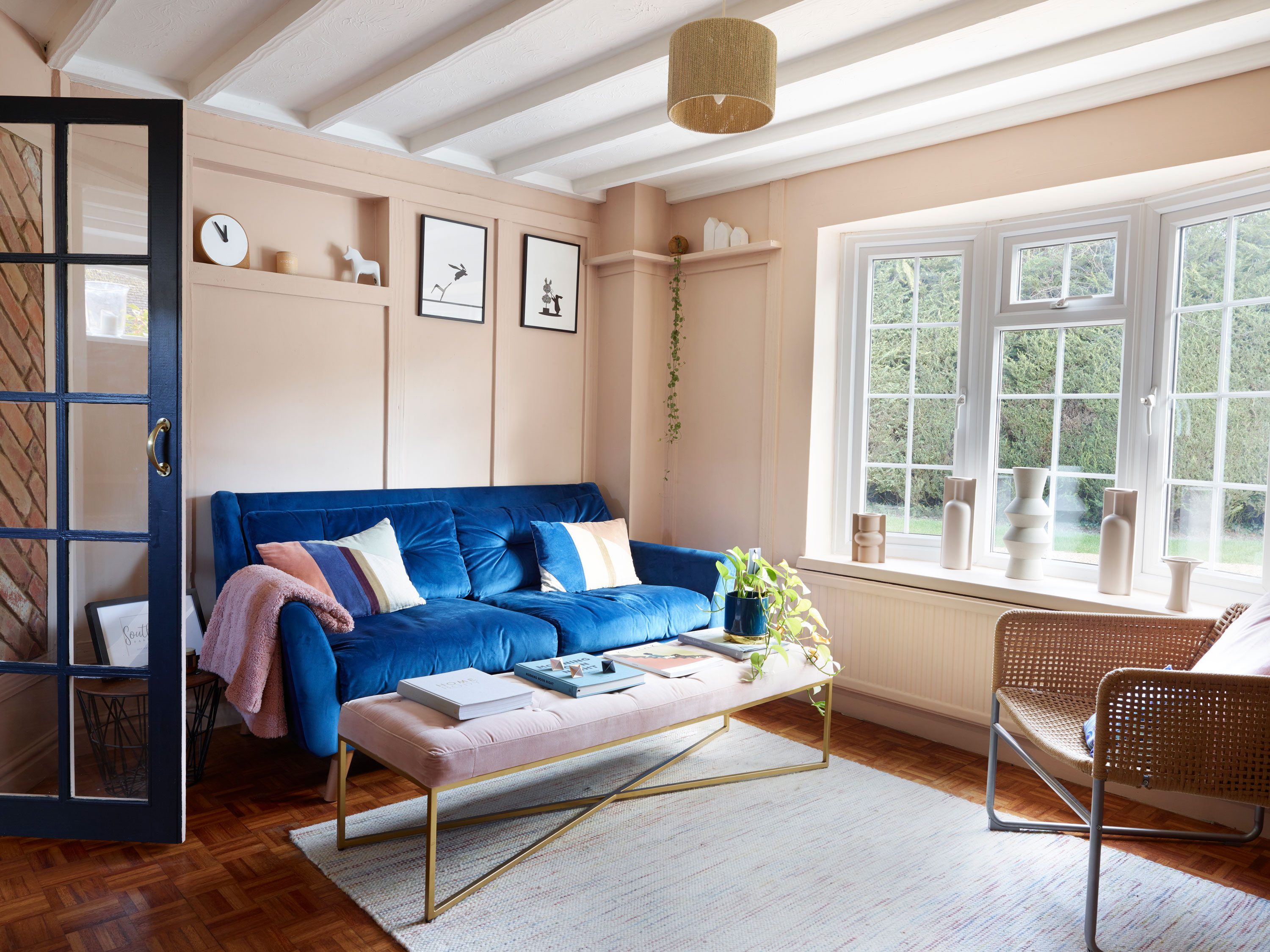 The blue velvet sofa from Dunelm provides a striking contrast to the pink scheme, while the velvet Julianne bench from Made.com is a quirky alternative to a coffee table The blue velvet sofa from Dunelm provides a striking contrast to the pink scheme, while the velvet Julianne bench from Made.com is a quirky alternative to a coffee table