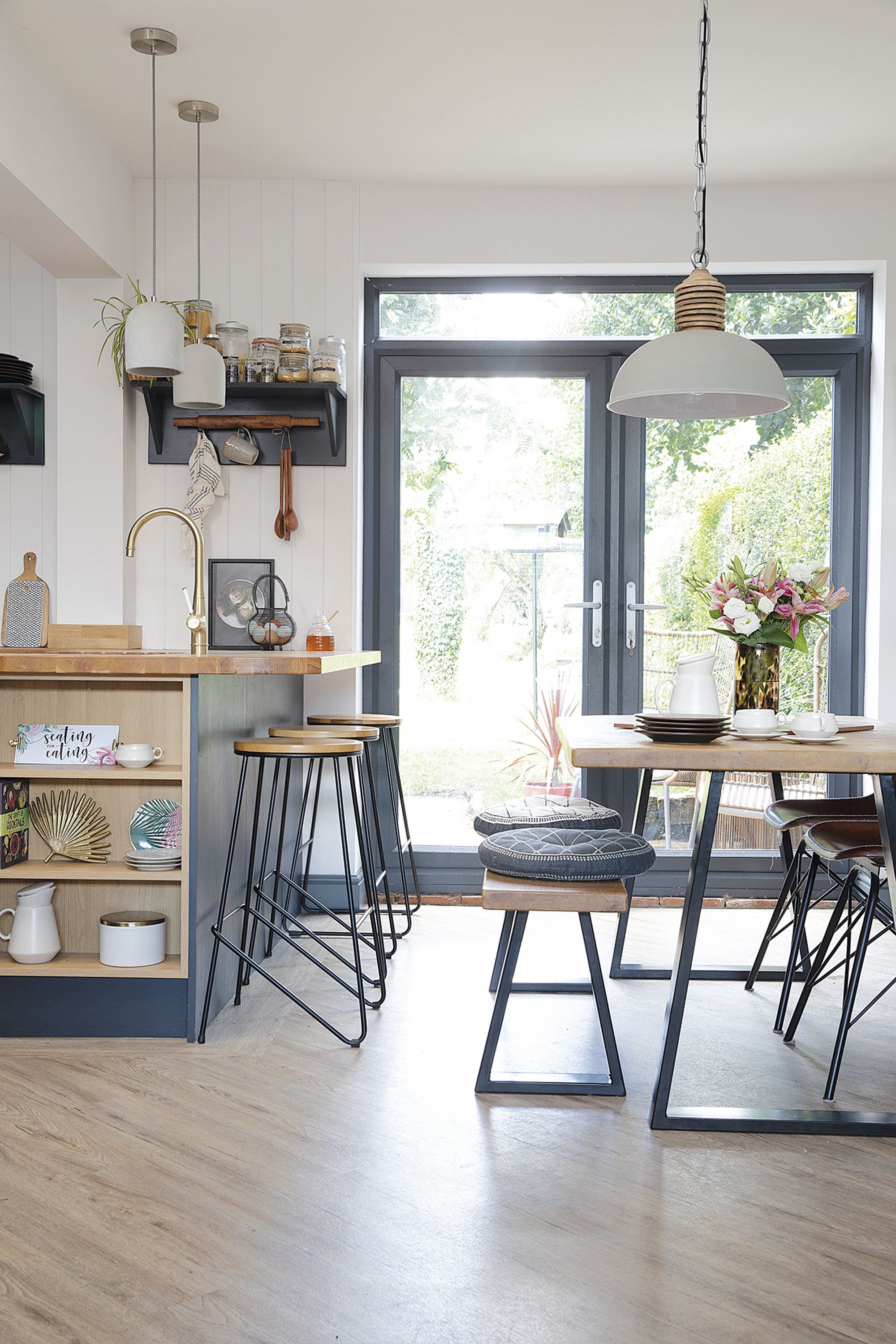 Laura’s dining table and bench from her previous home have been given a makeover with new A-frame legs from The Hairpin Leg Company teamed with faux leather chairs from Cult Furniture. ‘It’s gone from a country- style farmhouse table to something a bit more industrial,’ she says. ‘The striking pendant light from Vaunt Design with its lovely wooden detailing ties it all together’ Laura’s dining table and bench from her previous home have been given a makeover with new A-frame legs from The Hairpin Leg Company teamed with faux leather chairs from Cult Furniture. ‘It’s gone from a country- style farmhouse table to something a bit more industrial,’ she says. ‘The striking pendant light from Vaunt Design with its lovely wooden detailing ties it all together’