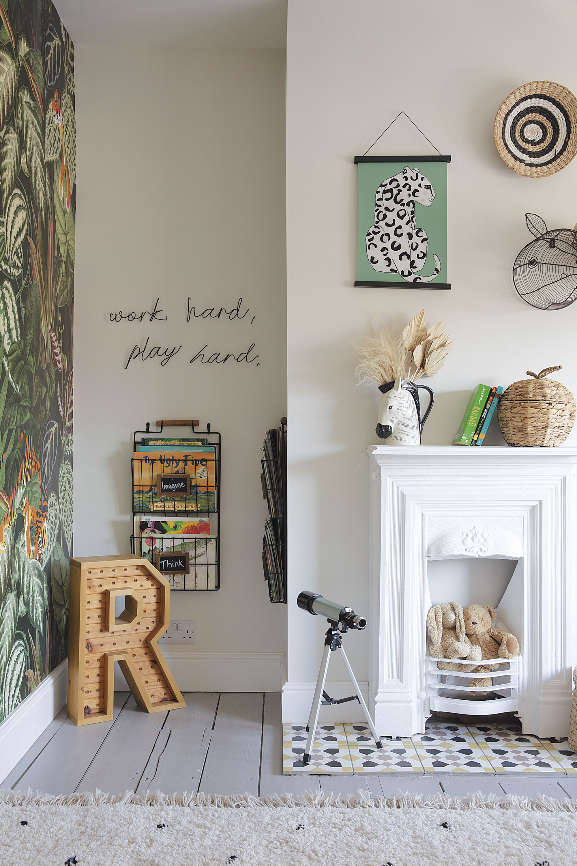 The starting point in here was the Mischievous Tigers wallpaper by Rebel Walls. Laura has added animal accessories to tie in, like the zebra jug from Next and leopard picture by Wonder & Rah. ‘The wooden letter was made by a family member @stuffbysmith,’ says Laura. ‘And the magazine racks from HomeSense are ideal for Rory’s storybooks’ The starting point in here was the Mischievous Tigers wallpaper by Rebel Walls. Laura has added animal accessories to tie in, like the zebra jug from Next and leopard picture by Wonder & Rah. ‘The wooden letter was made by a family member @stuffbysmith,’ says Laura. ‘And the magazine racks from HomeSense are ideal for Rory’s storybooks’