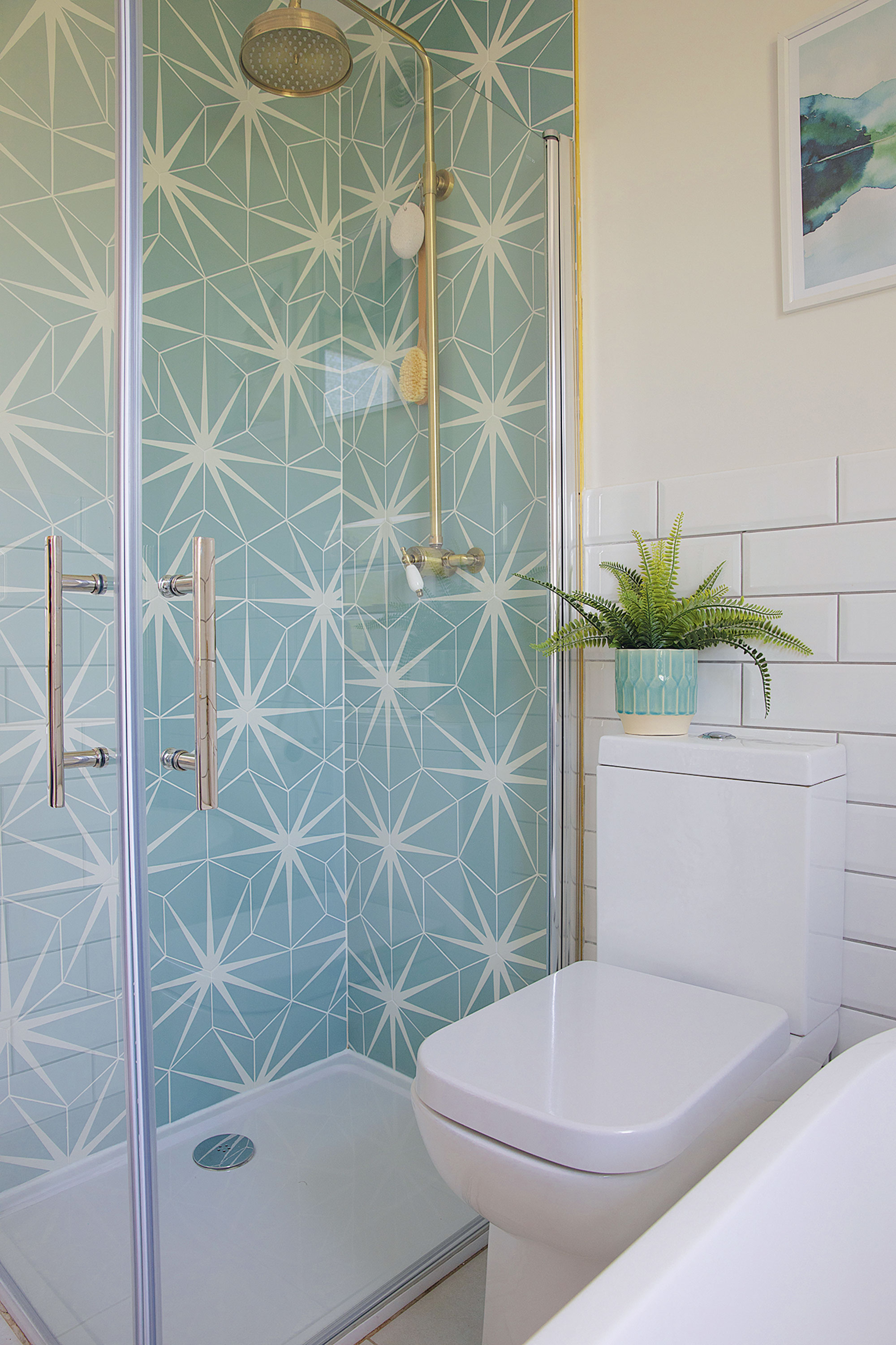 ‘Although I’ve generally tried to keep costs down by using standard metro tiles on most of the walls, the Lily Pad shower tiles from Ca’ Pietra were my little bit of luxury,’ says Laura. ‘They really make a statement and work well with the antique bronze shower from House of Enki’ ‘Although I’ve generally tried to keep costs down by using standard metro tiles on most of the walls, the Lily Pad shower tiles from Ca’ Pietra were my little bit of luxury,’ says Laura. ‘They really make a statement and work well with the antique bronze shower from House of Enki’